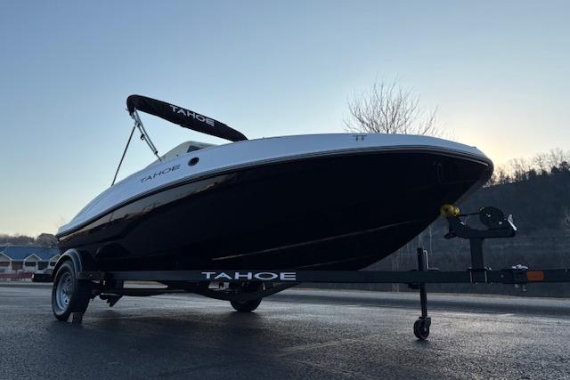 2026 Tahoe T16 boat on trailer at sunset, showcasing sleek design and modern features.