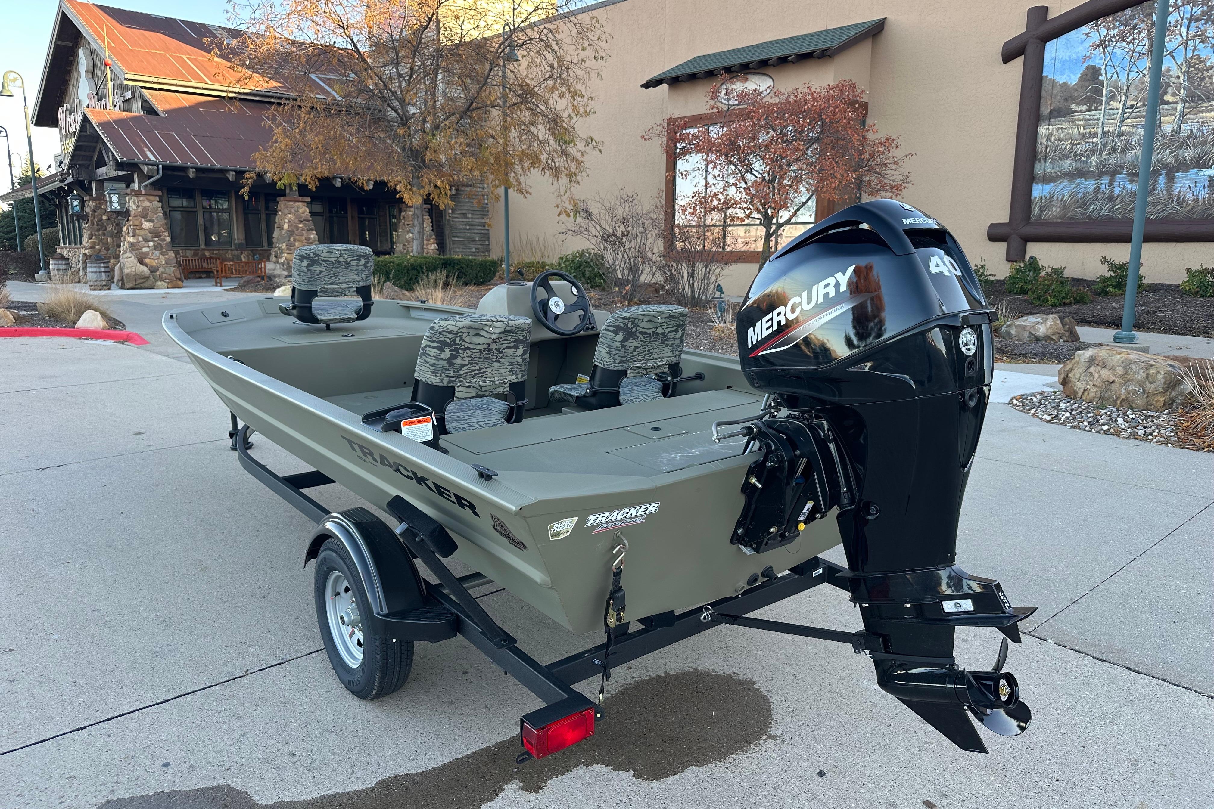 2026 Tracker Grizzly 1754 SC boat with Mercury 40HP engine, parked outdoors.