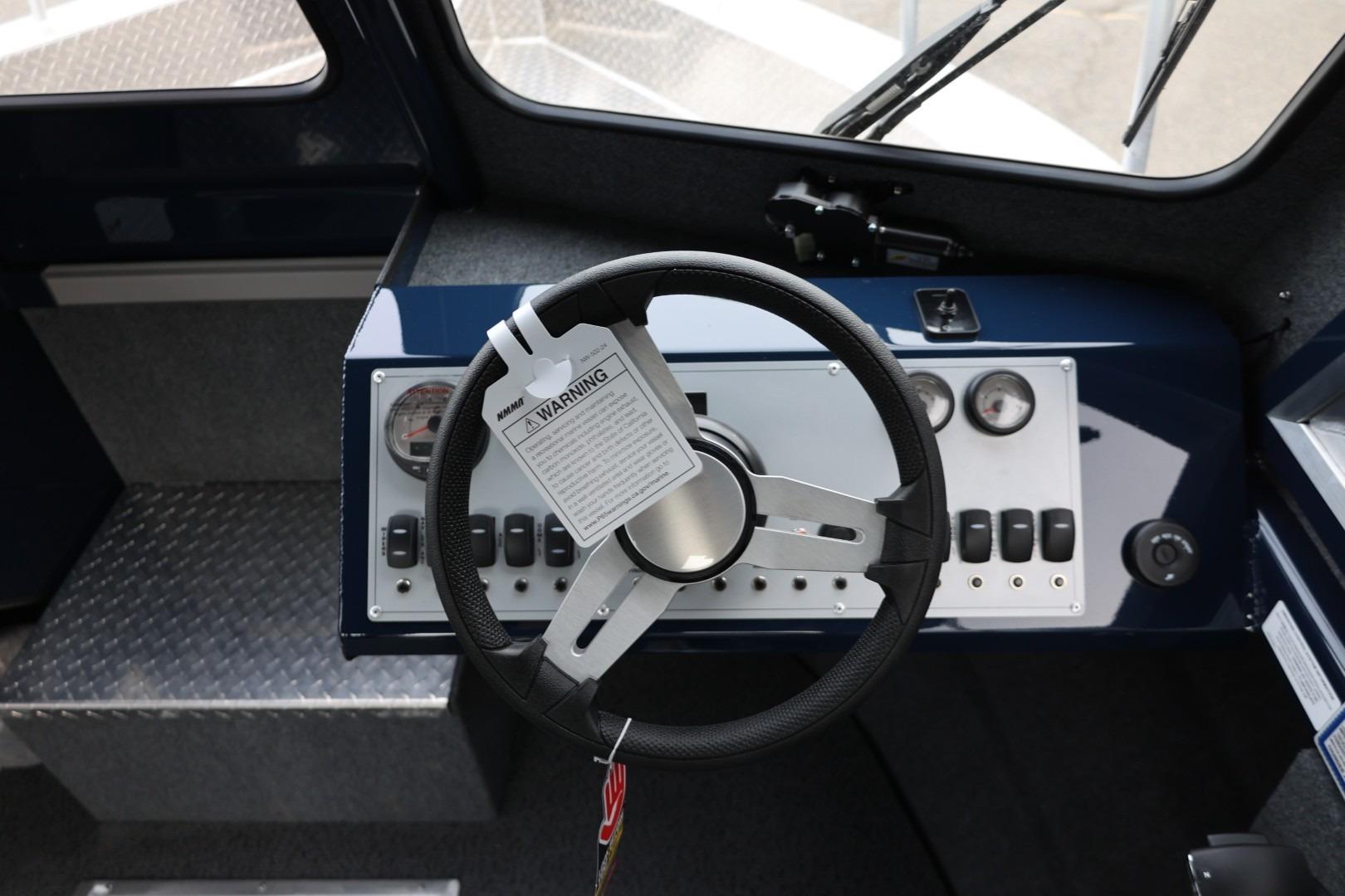 2026 Thunder Jet 24 Alexis Pro dashboard with steering wheel and control panel.