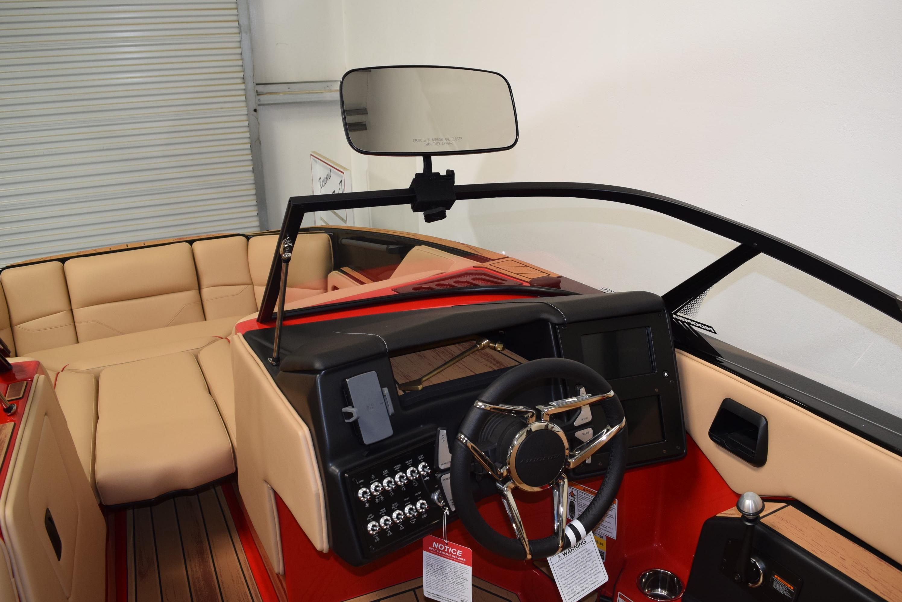 2026 Moomba Max boat interior with beige seating and modern dashboard design.