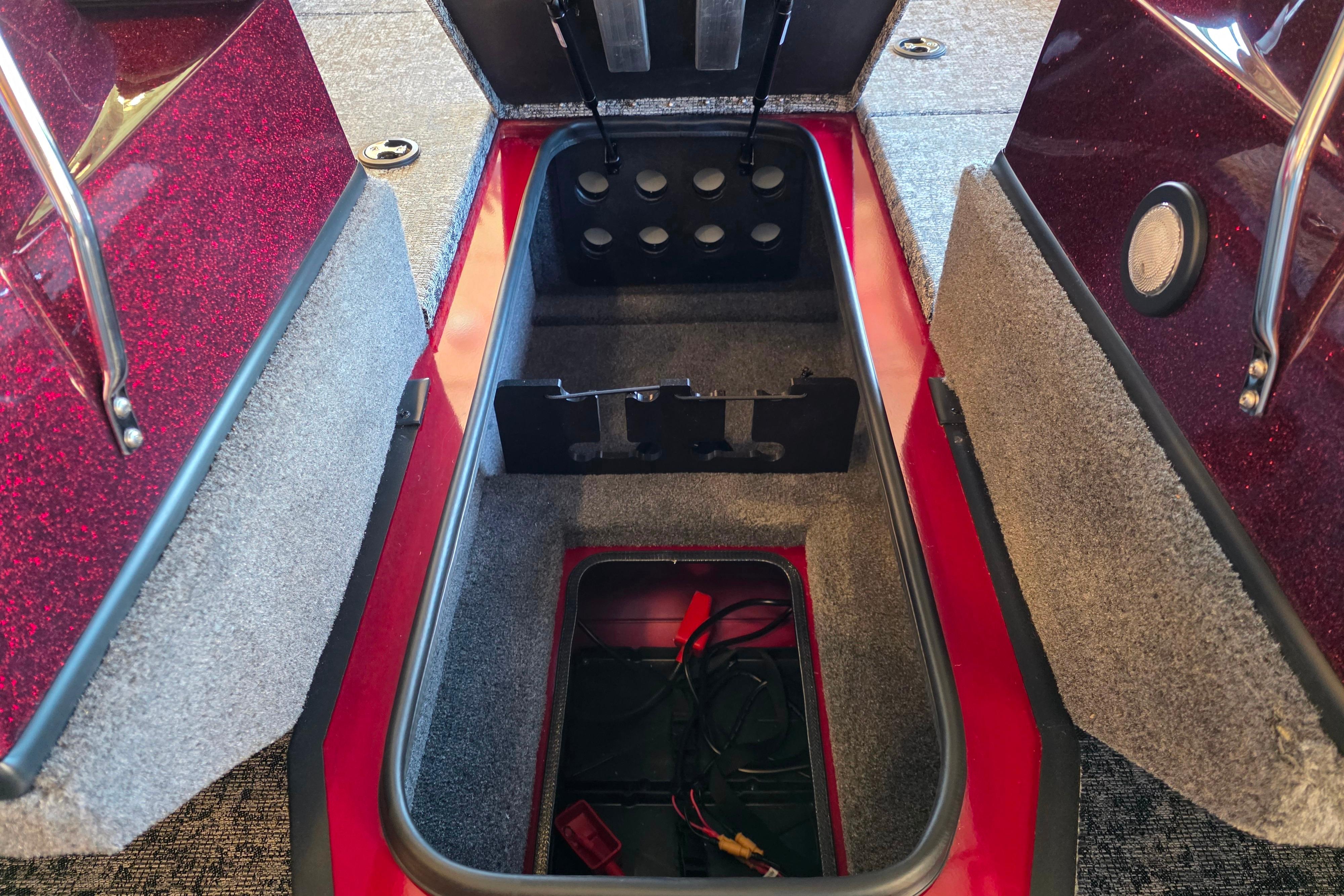 Storage compartment of 2026 Ranger VS1782SC Reata boat, featuring carpeted interior and wiring.