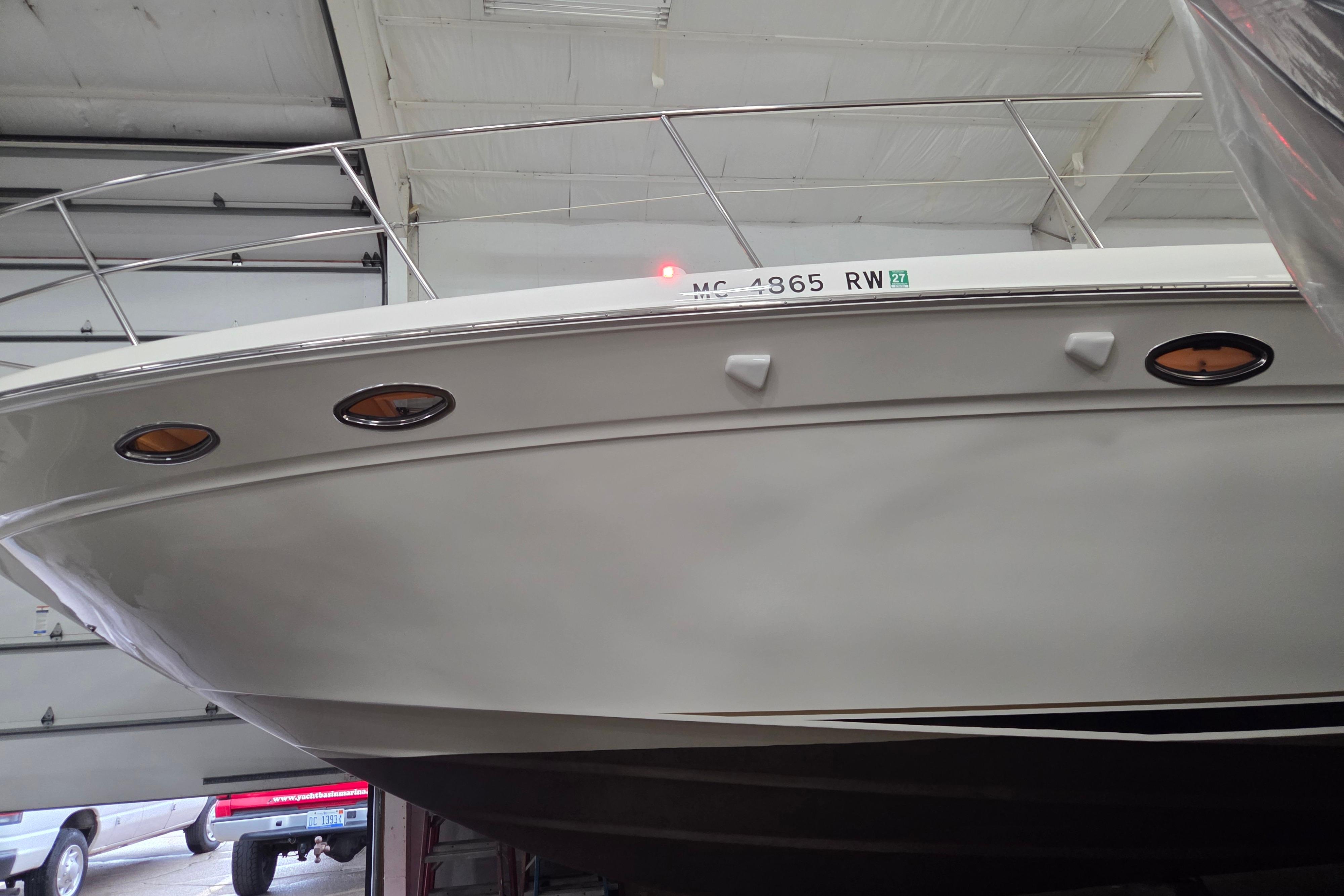 2000 Sea Ray Sundancer 540 yacht in a garage, showcasing its sleek hull design.