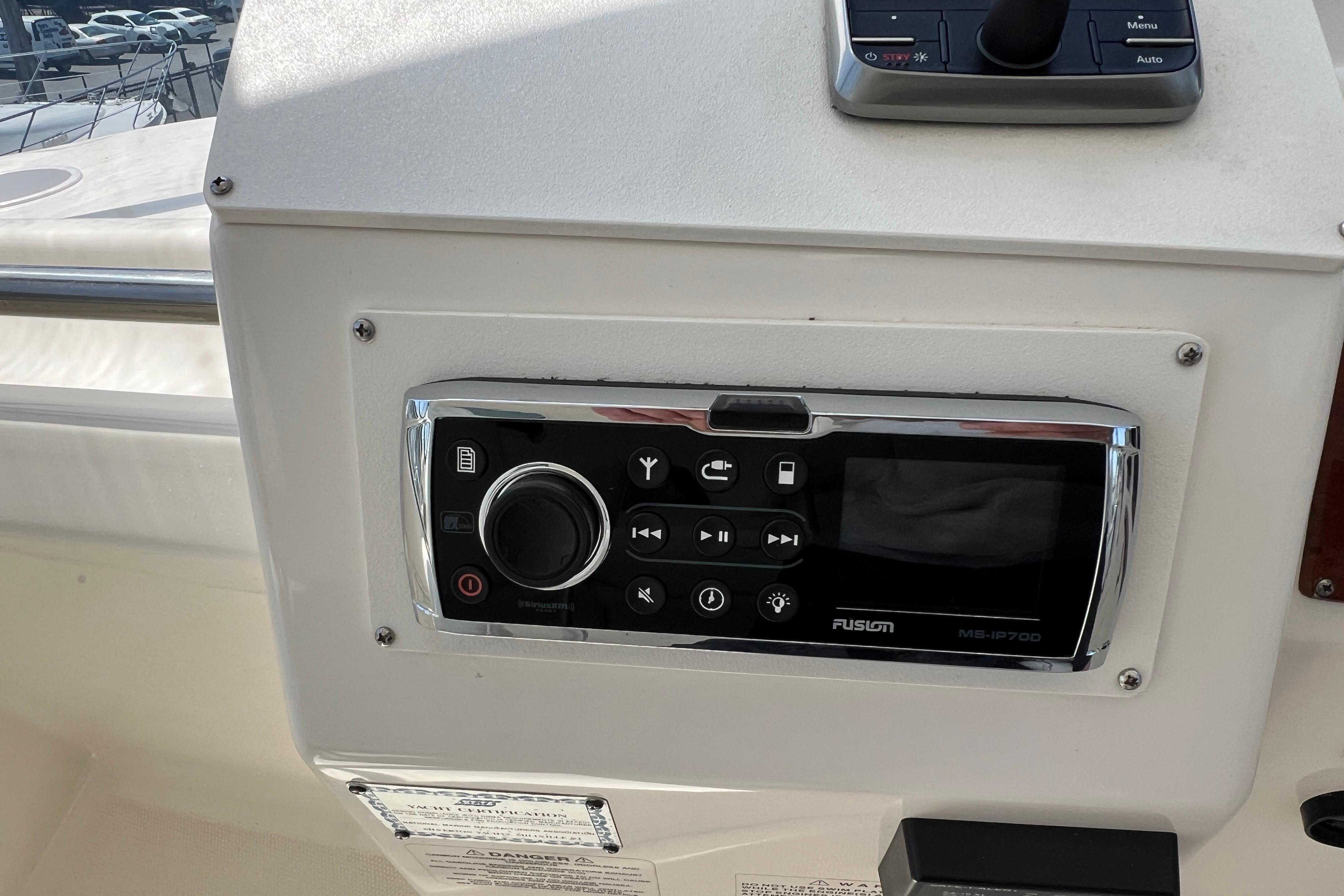 Control panel on 2002 Silverton 453 Motor Yacht with Fusion MS-IP700 stereo system.