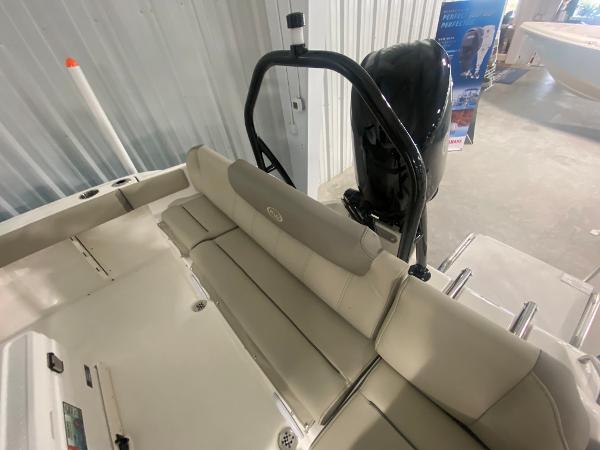 2024 Key West 219 FS boat interior with seating and outboard motor.