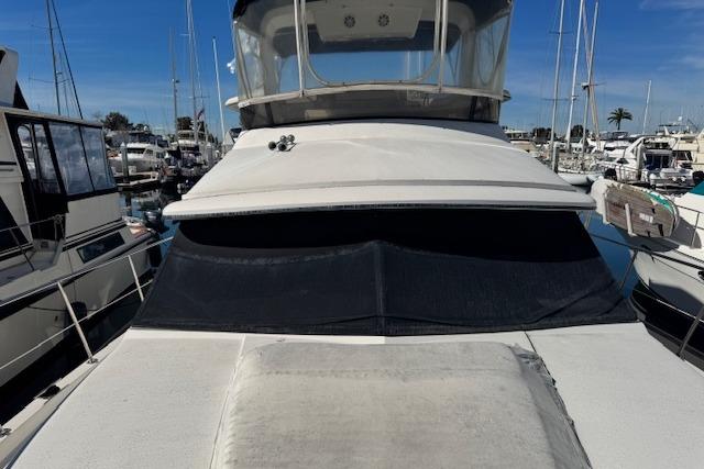 1986 Carver 4207 Aft Cabin Motor Yacht docked in marina.
