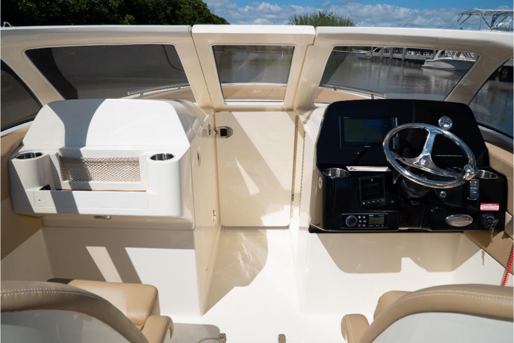 2023 Scout 240 Dorado boat interior with steering wheel and dashboard.
