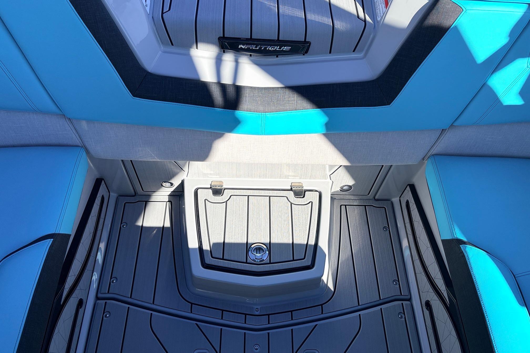 Interior of 2026 Nautique Super Air Nautique G23 boat with blue and gray seating.