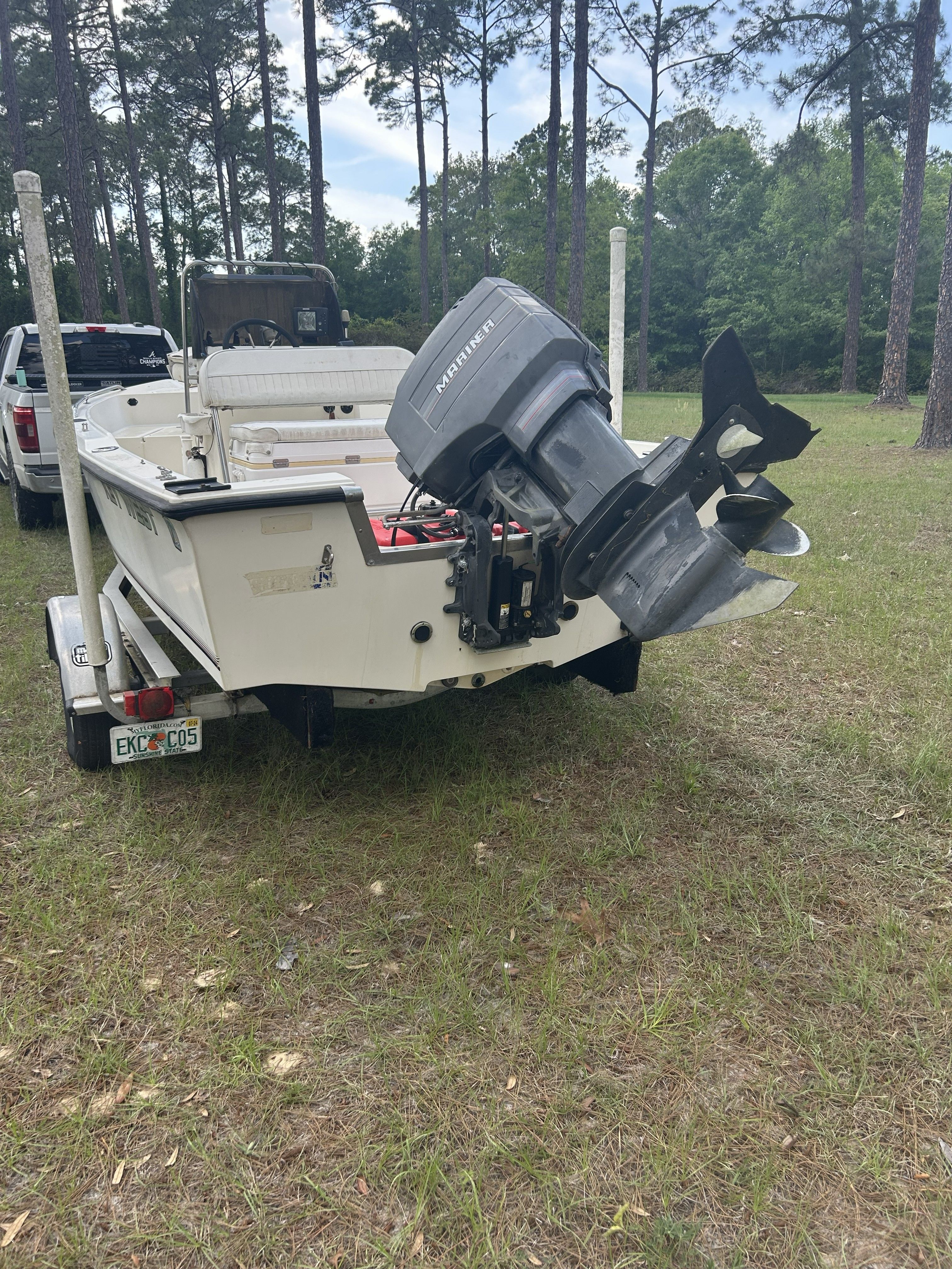 1993 Key West 1720 boat with outboard motor on trailer.
