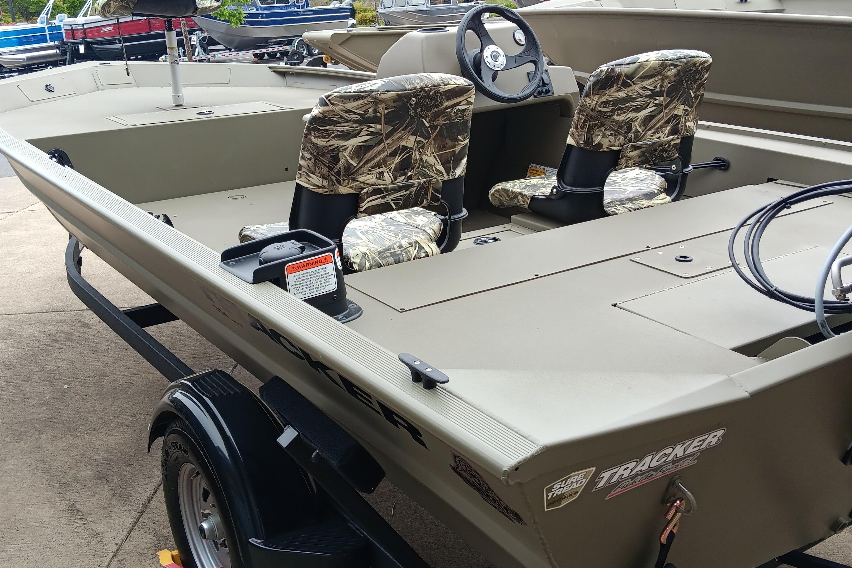 2026 Tracker Grizzly 1754 SC boat with camo seats and steering console.