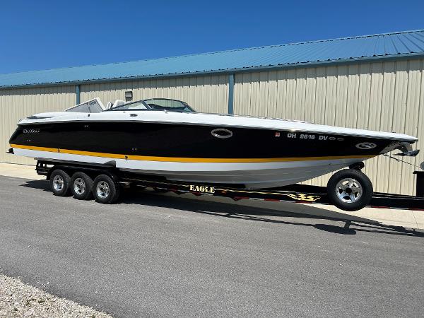 2005 Cobalt 343 boat on a trailer outside a storage facility.