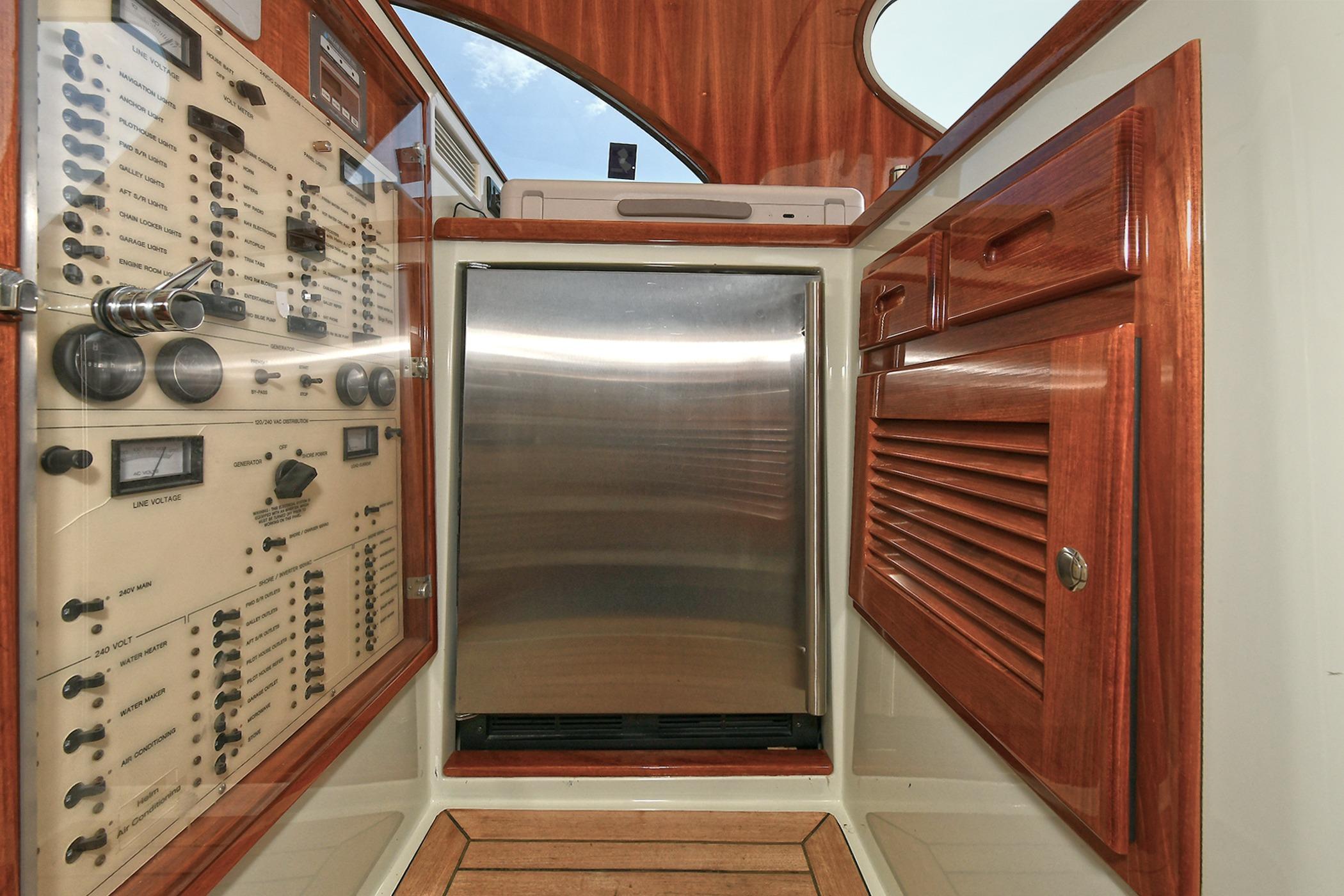 Control panel and cabinetry inside a 2005 San Juan Downeast Express boat.