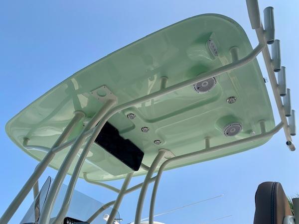 T-top of 2025 Pioneer 222 Islander boat with speakers and rod holders against blue sky.