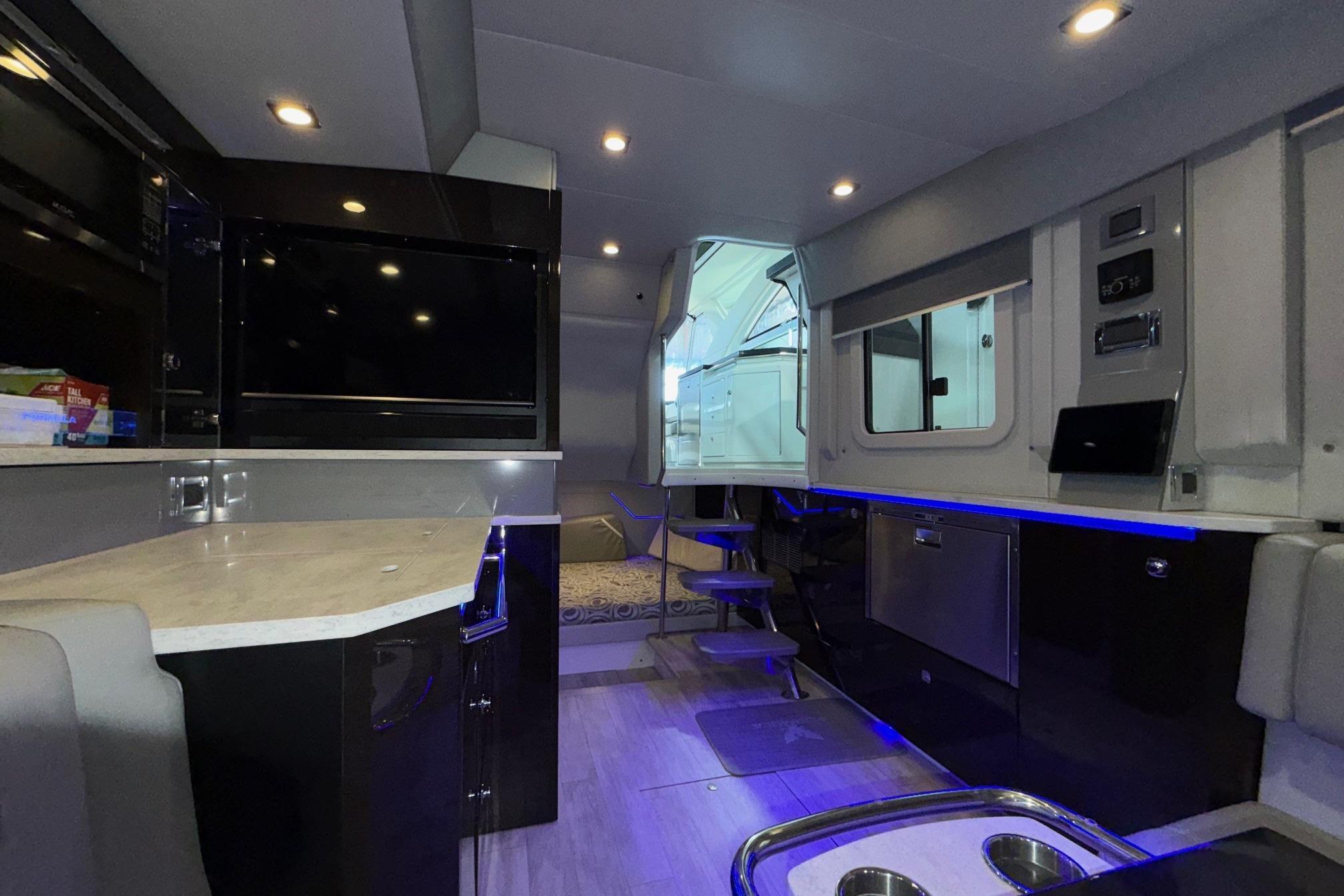 Luxurious interior of a 2017 Formula 430 Super Sport Crossover boat with modern amenities.