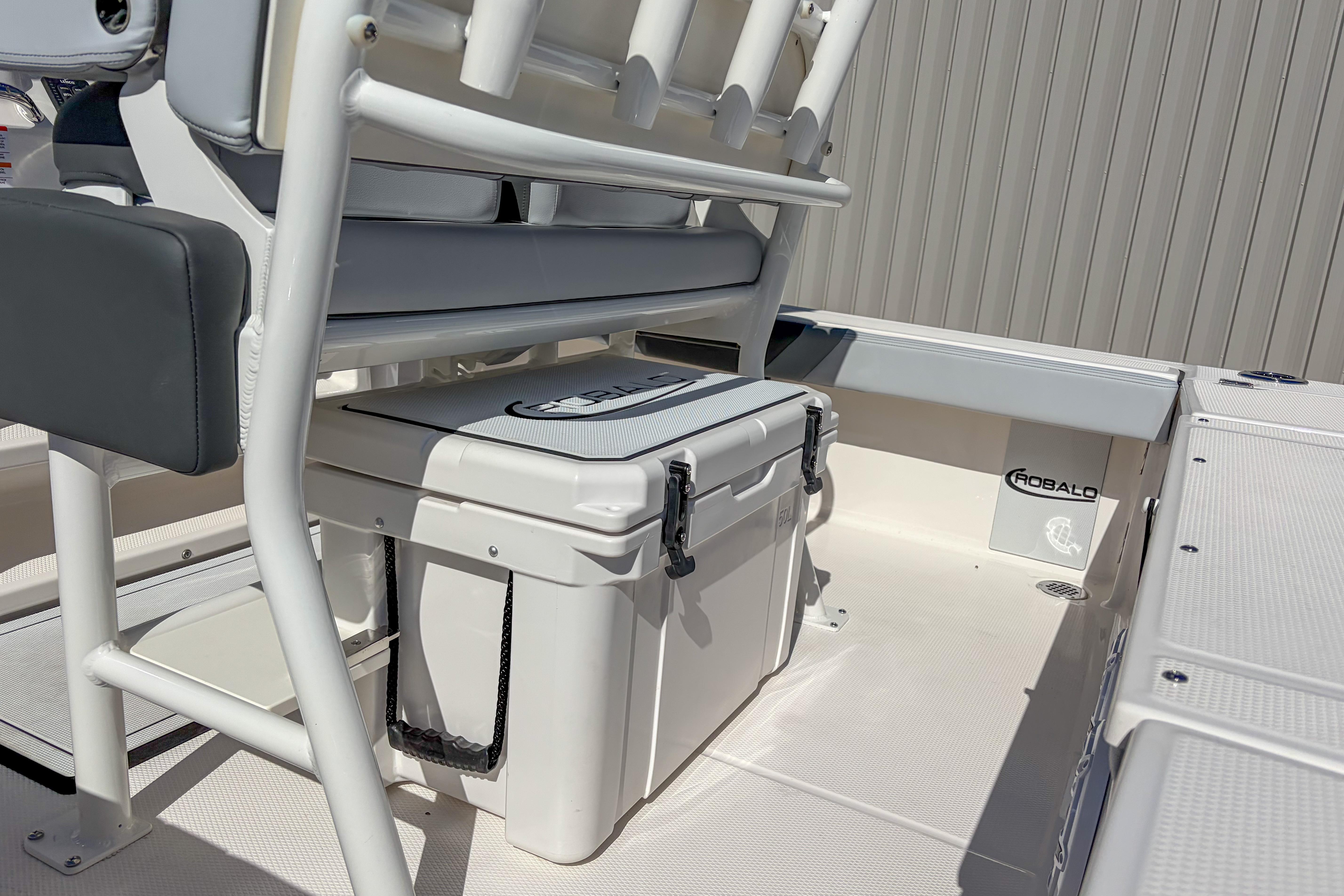 2025 Robalo 226 Cayman boat interior with seating and storage cooler.
