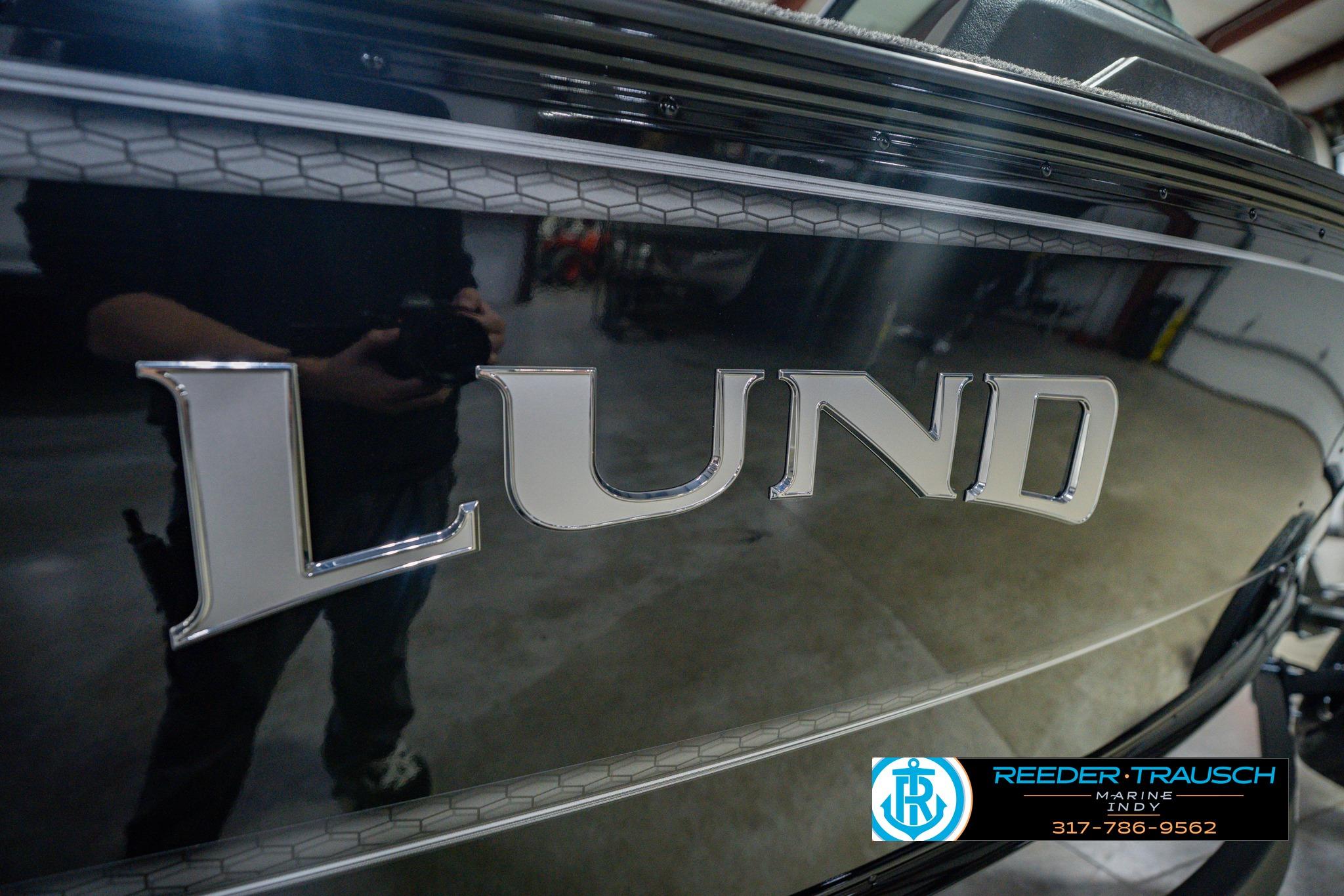 2026 Lund 1775 Impact XS boat with sleek black exterior and prominent logo.