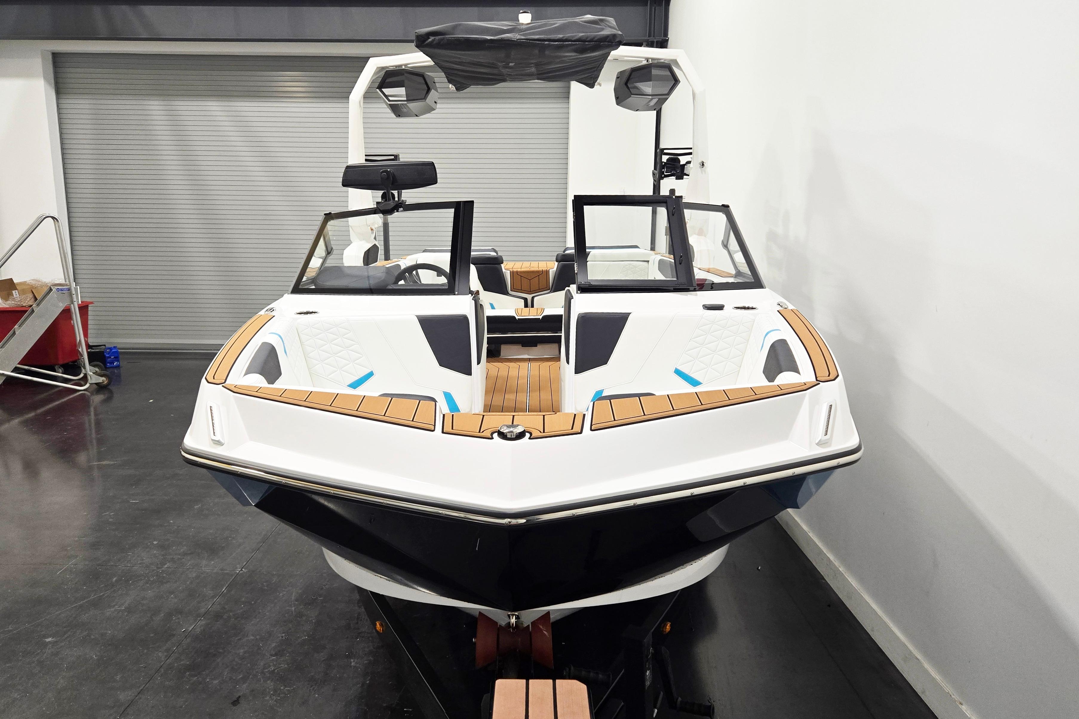 2026 Nautique Super Air Nautique GS22 boat in showroom, front view.