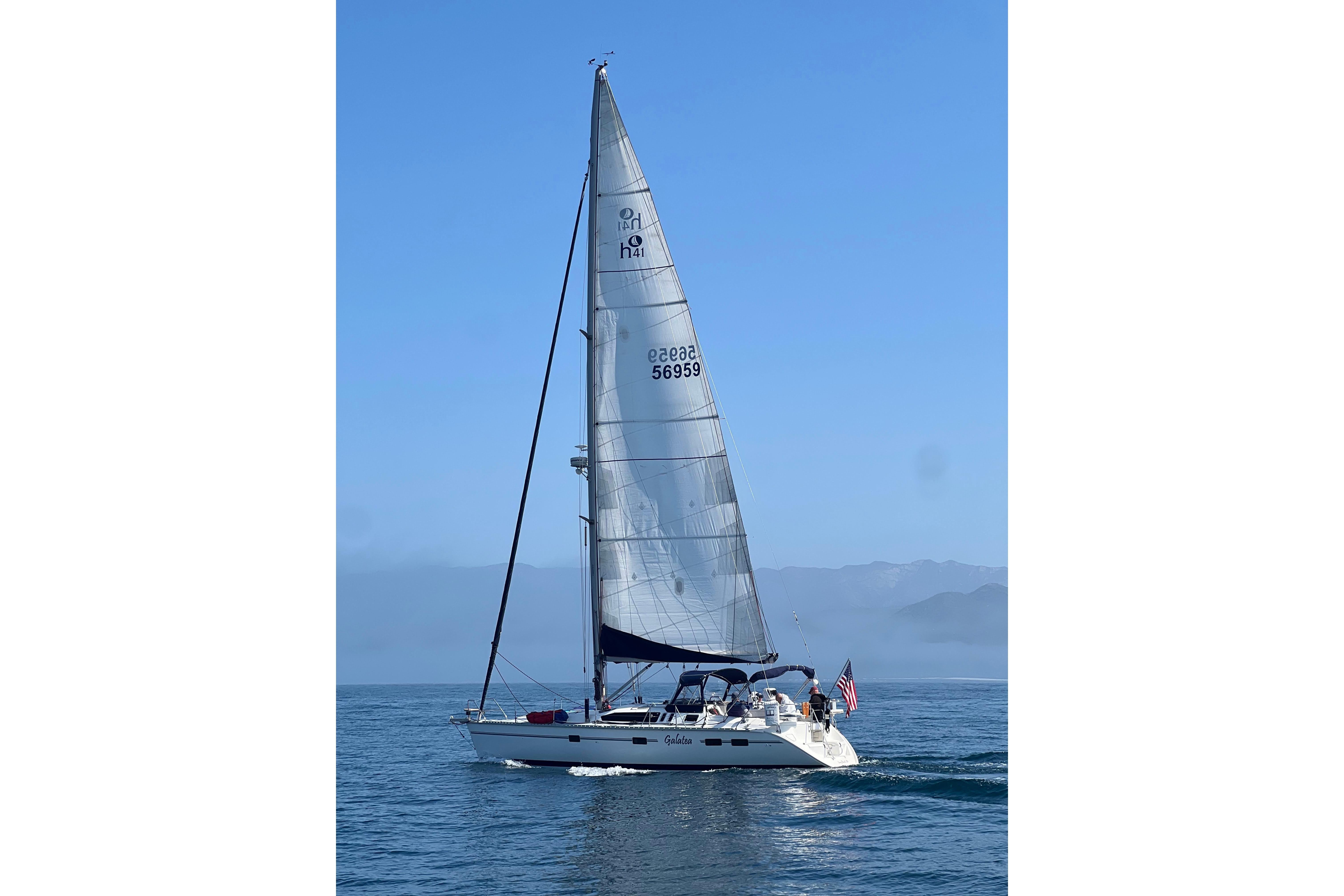 Sailing yacht Hunter Legend 40.5, 1997 model, cruising on calm blue waters.
