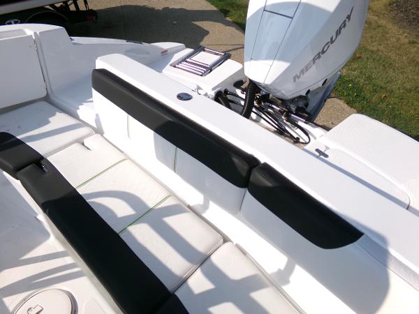 2024 Tahoe 2150 CC boat interior with Mercury engine, featuring white and black seating.