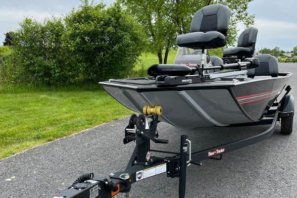 2025 Tracker Bass Tracker Classic XL boat on trailer, parked on a paved road.