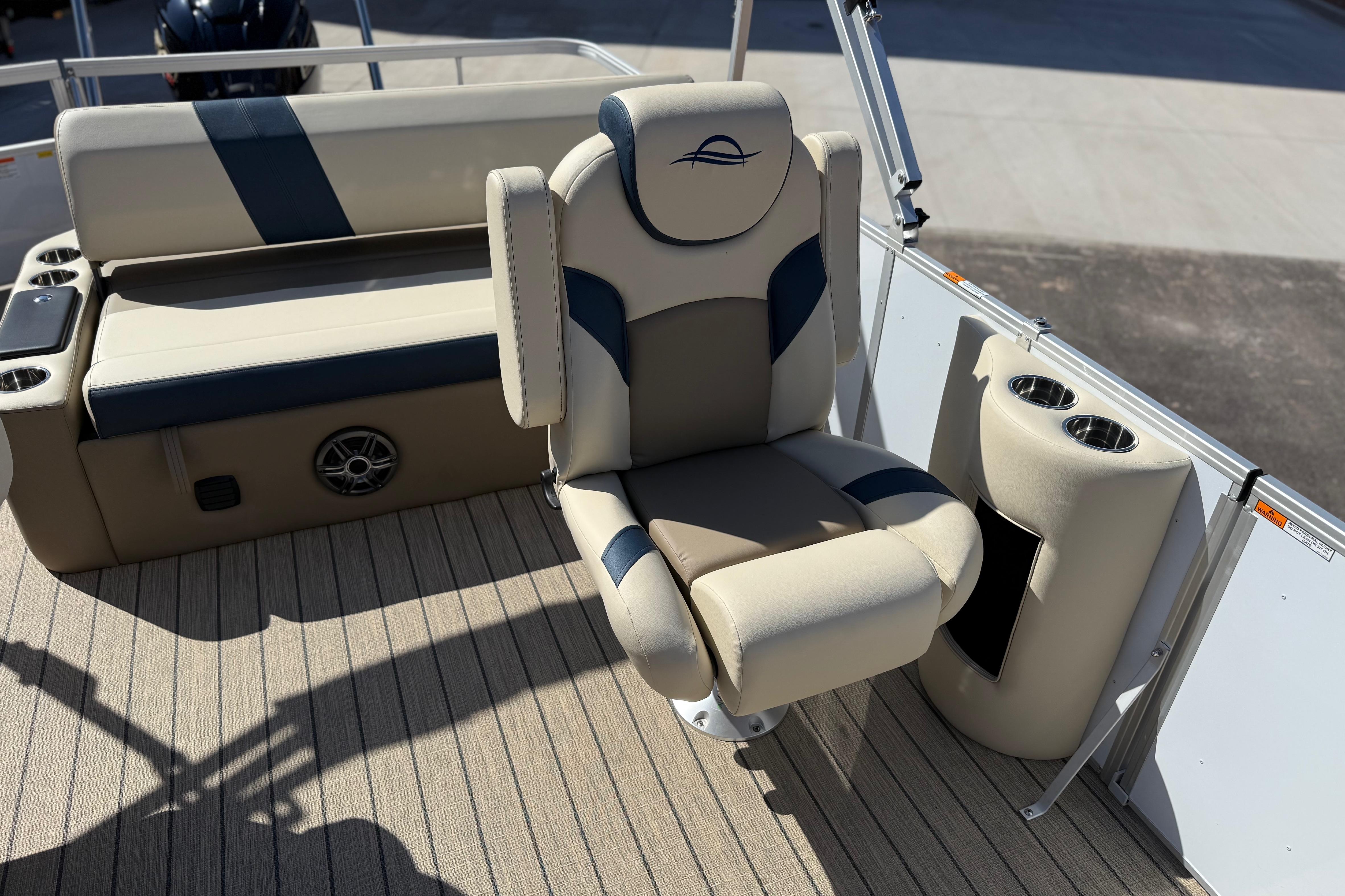 Luxurious seating on 2026 SunCatcher Select 322SL boat, featuring cup holders and stylish design.