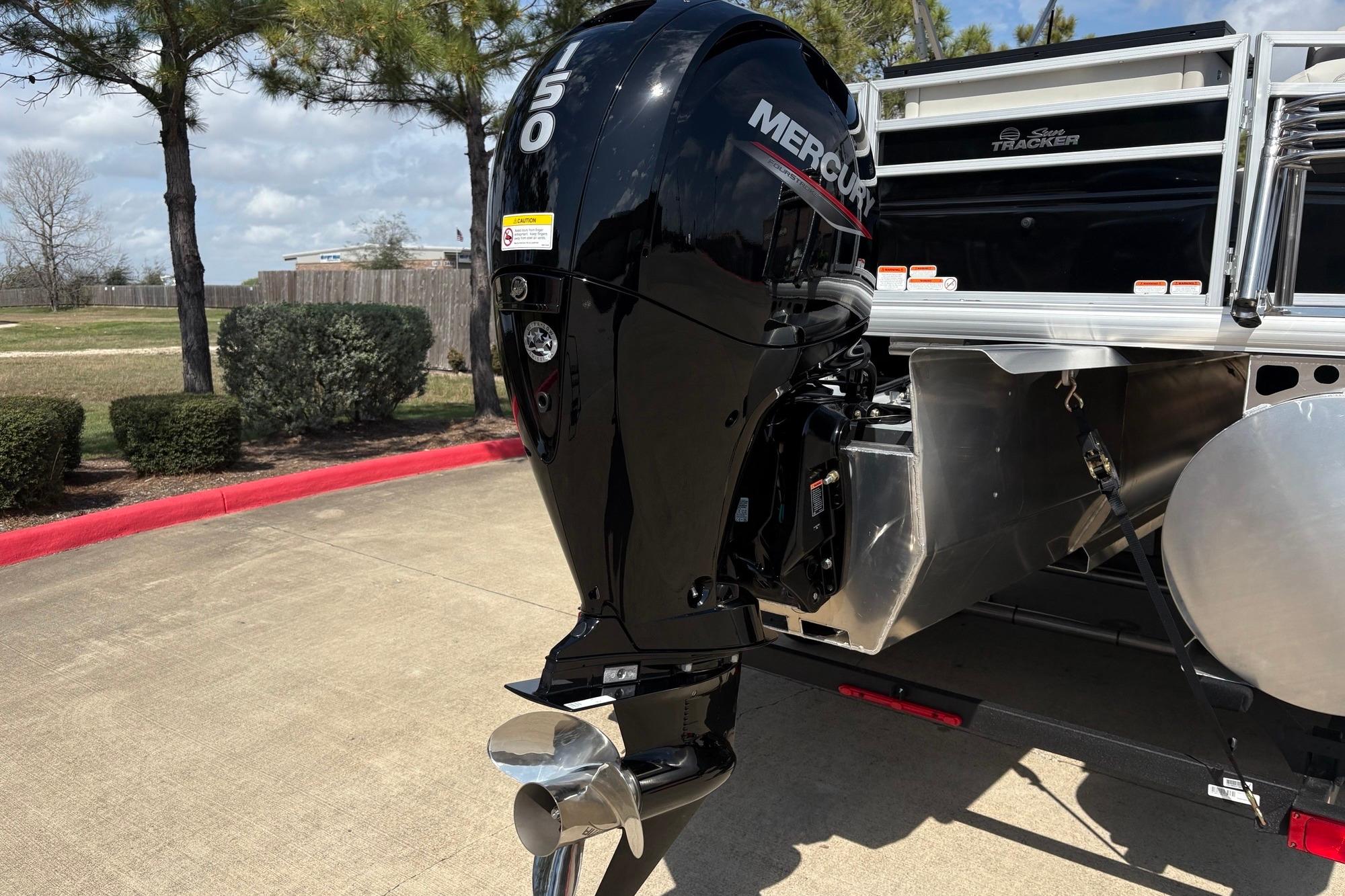 2026 Sun Tracker Fishin' Barge 22 XP3 with Mercury 150 outboard motor.