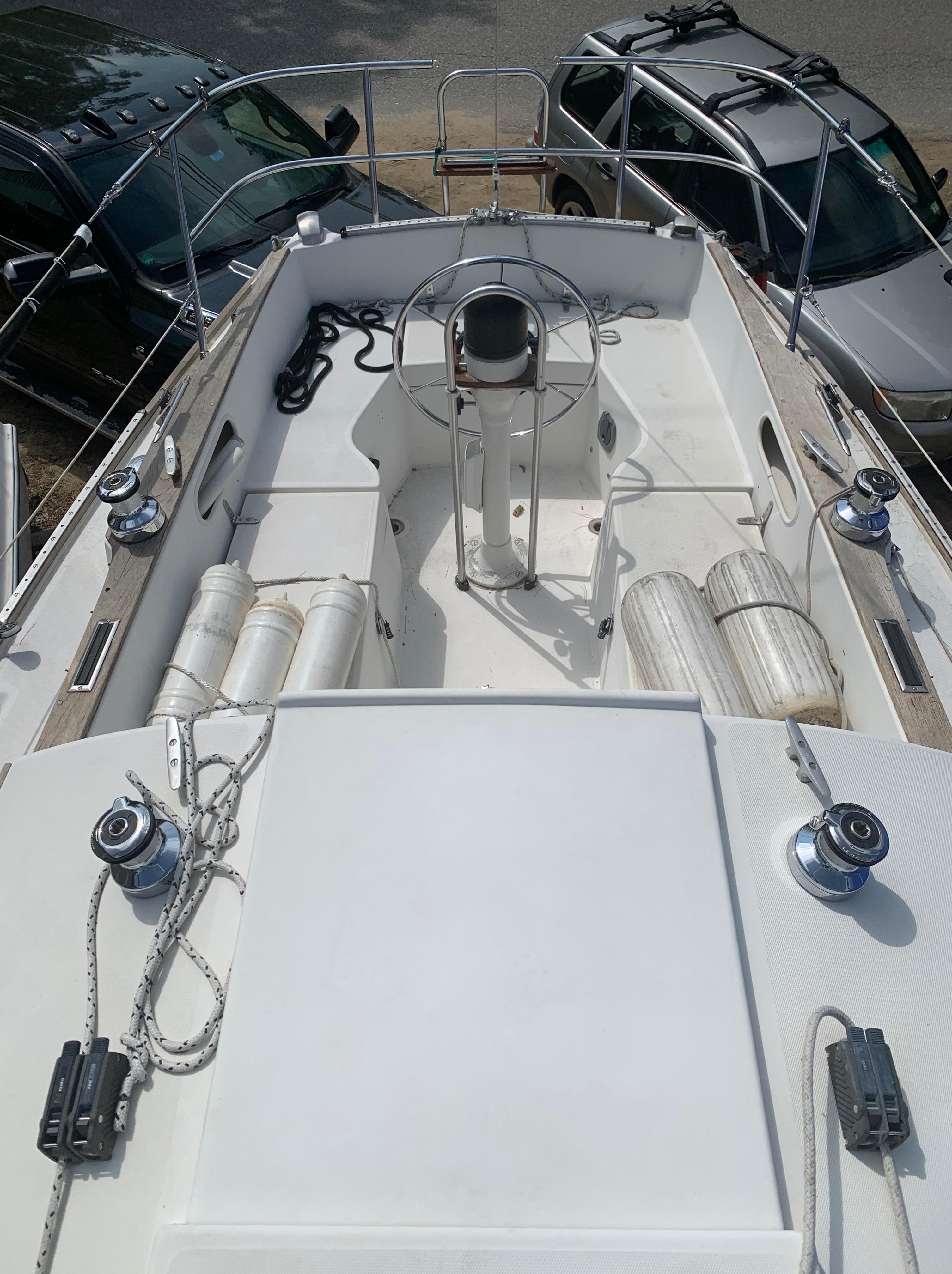 1979 Sabre 28-2 sailboat deck with steering wheel and winches.