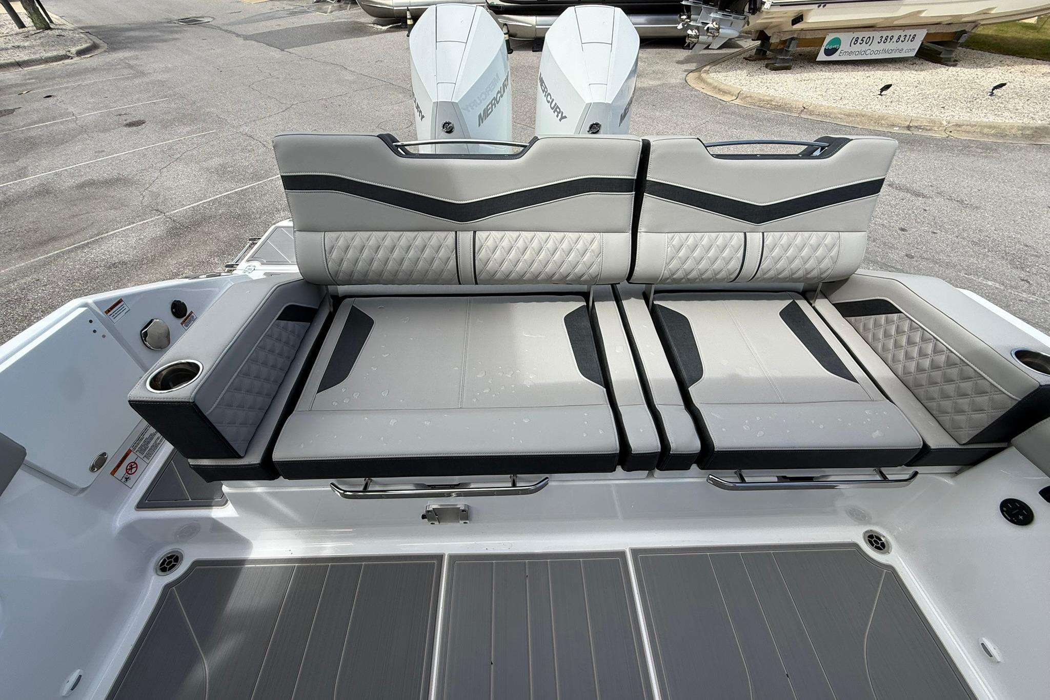 Luxury seating on 2027 Monterey Elite 30 OB boat, featuring sleek design and premium upholstery.