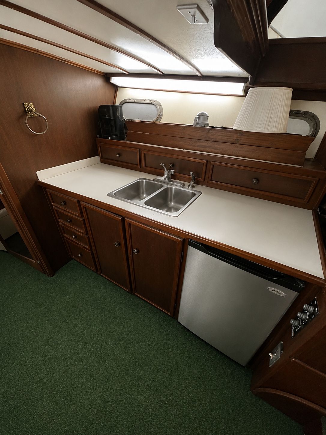 Interior of 1951 Chris-Craft 50 Catalina yacht, featuring kitchen and sink.