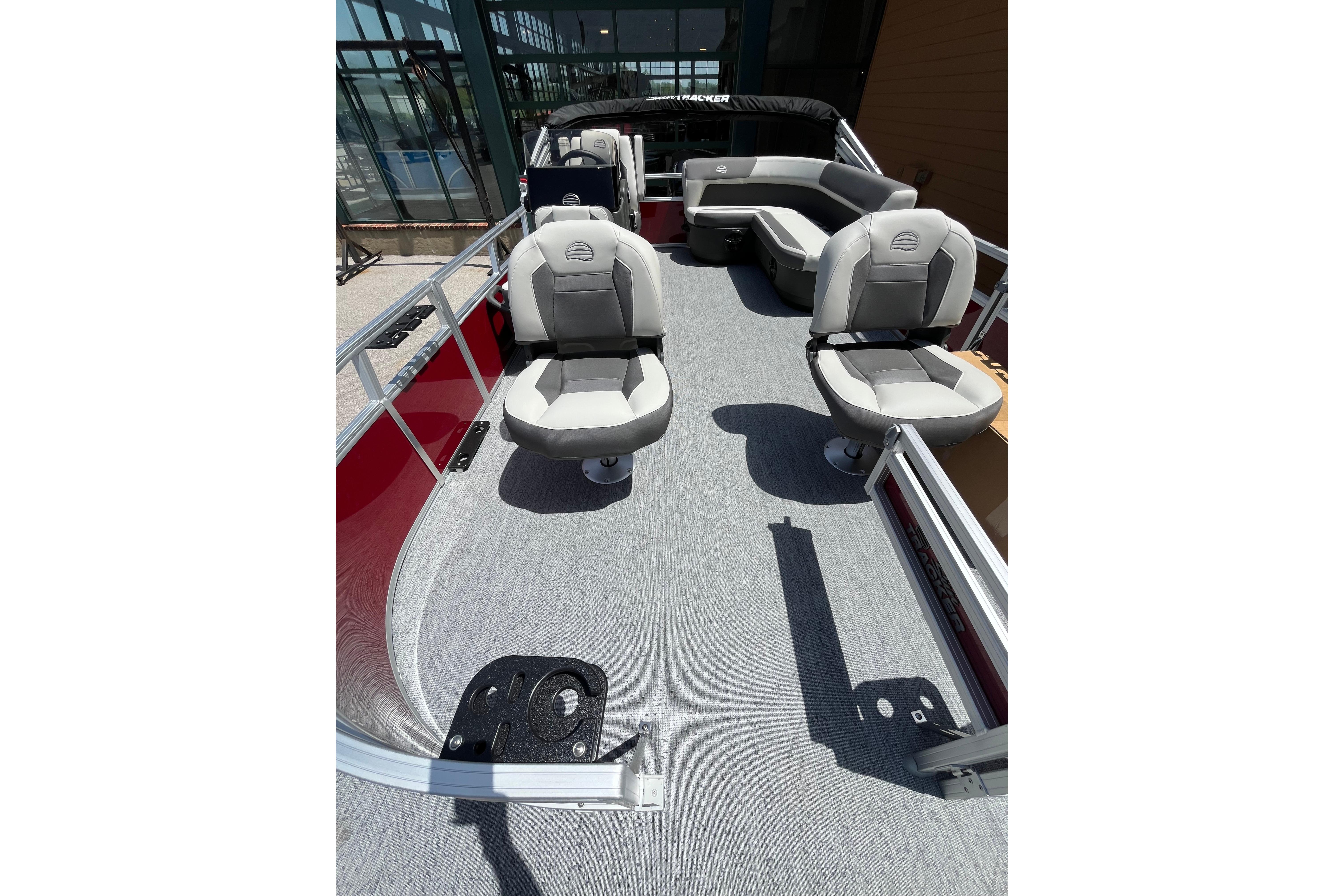 2026 Sun Tracker Bass Buggy 16 XL Select pontoon boat interior with seating and modern design.