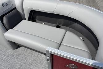 2026 Sun Tracker Party Barge 18 DLX interior seating with gray upholstery and cup holders.