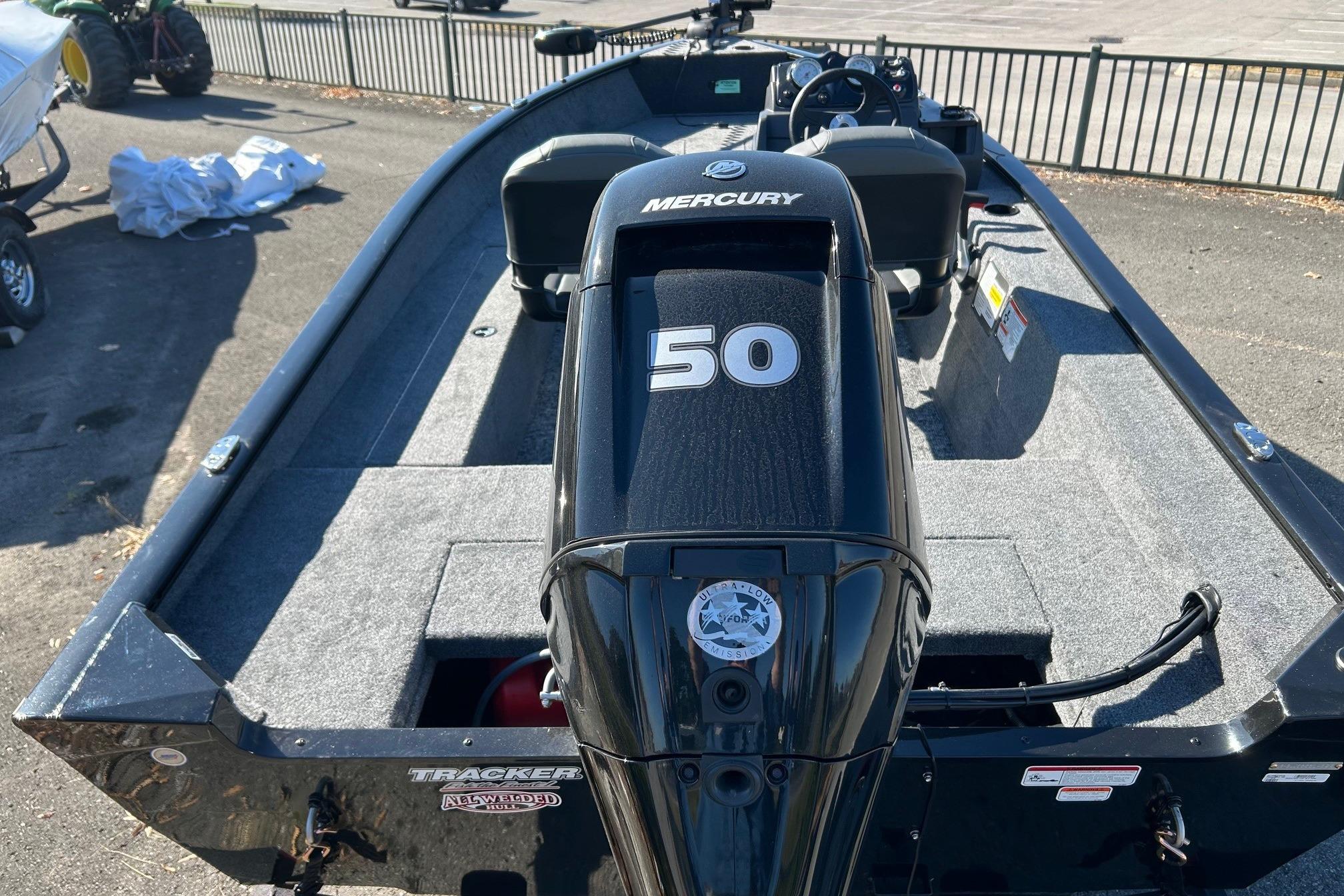 2026 Tracker Super Guide V-16 SC boat with Mercury 50 engine, parked outdoors.