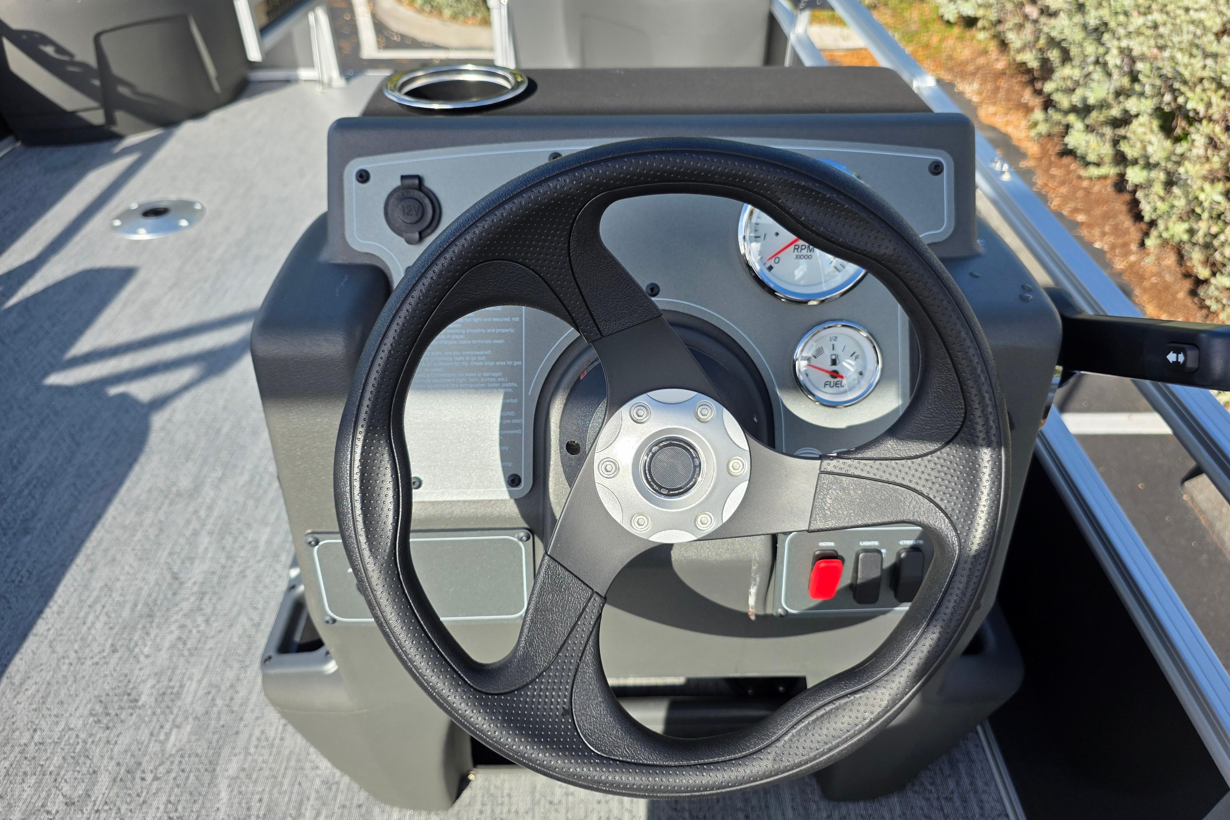 Steering console of 2026 Sun Tracker Bass Buggy 16 XL Select pontoon boat.
