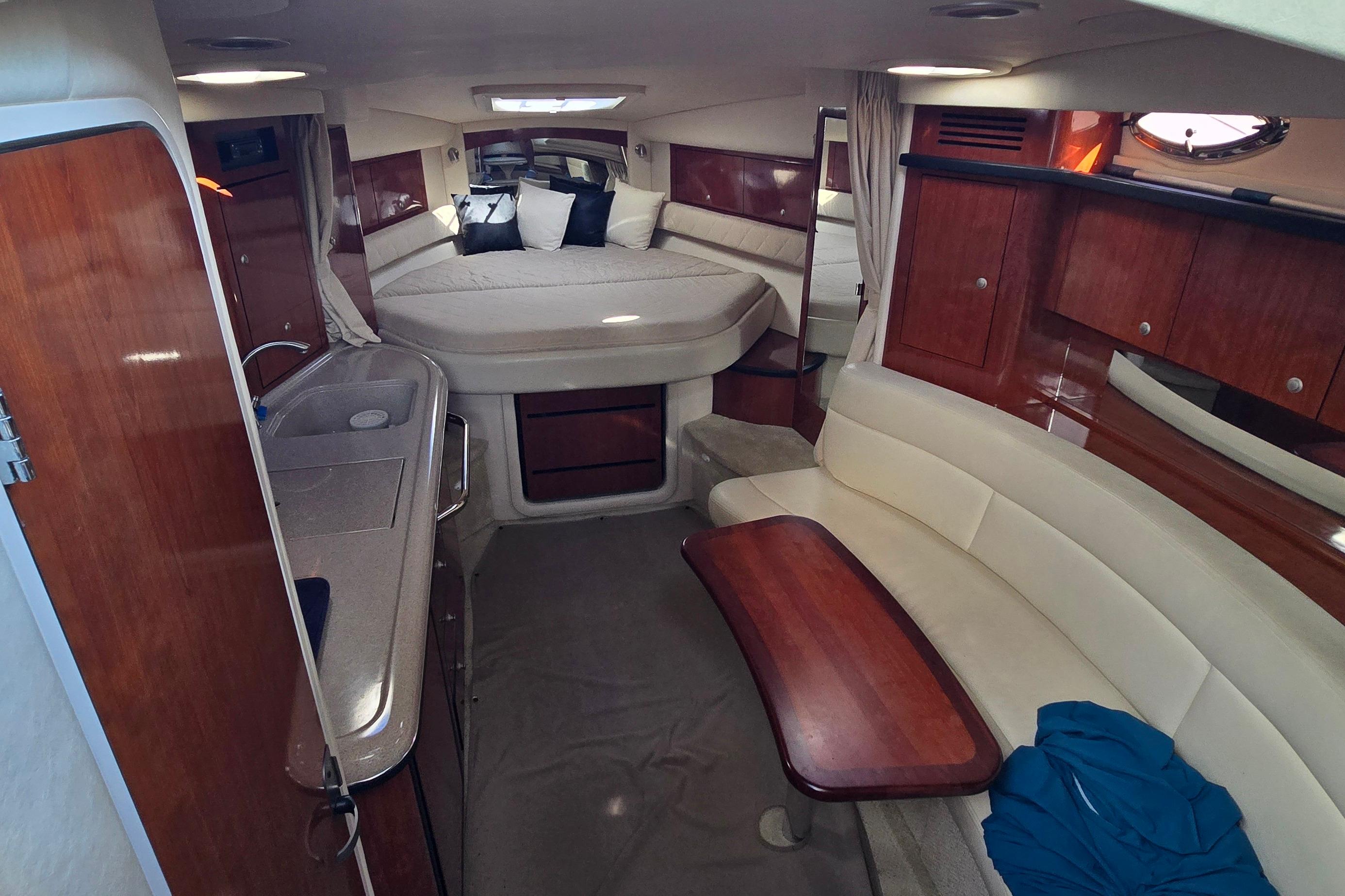 Luxurious interior of a 2007 Sea Ray 340 Sundancer yacht with elegant wood finishes.