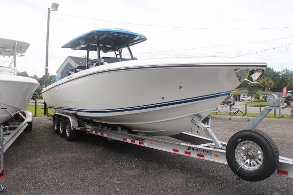 2024 Fountain 34 SC boat on trailer, side view, outdoors.