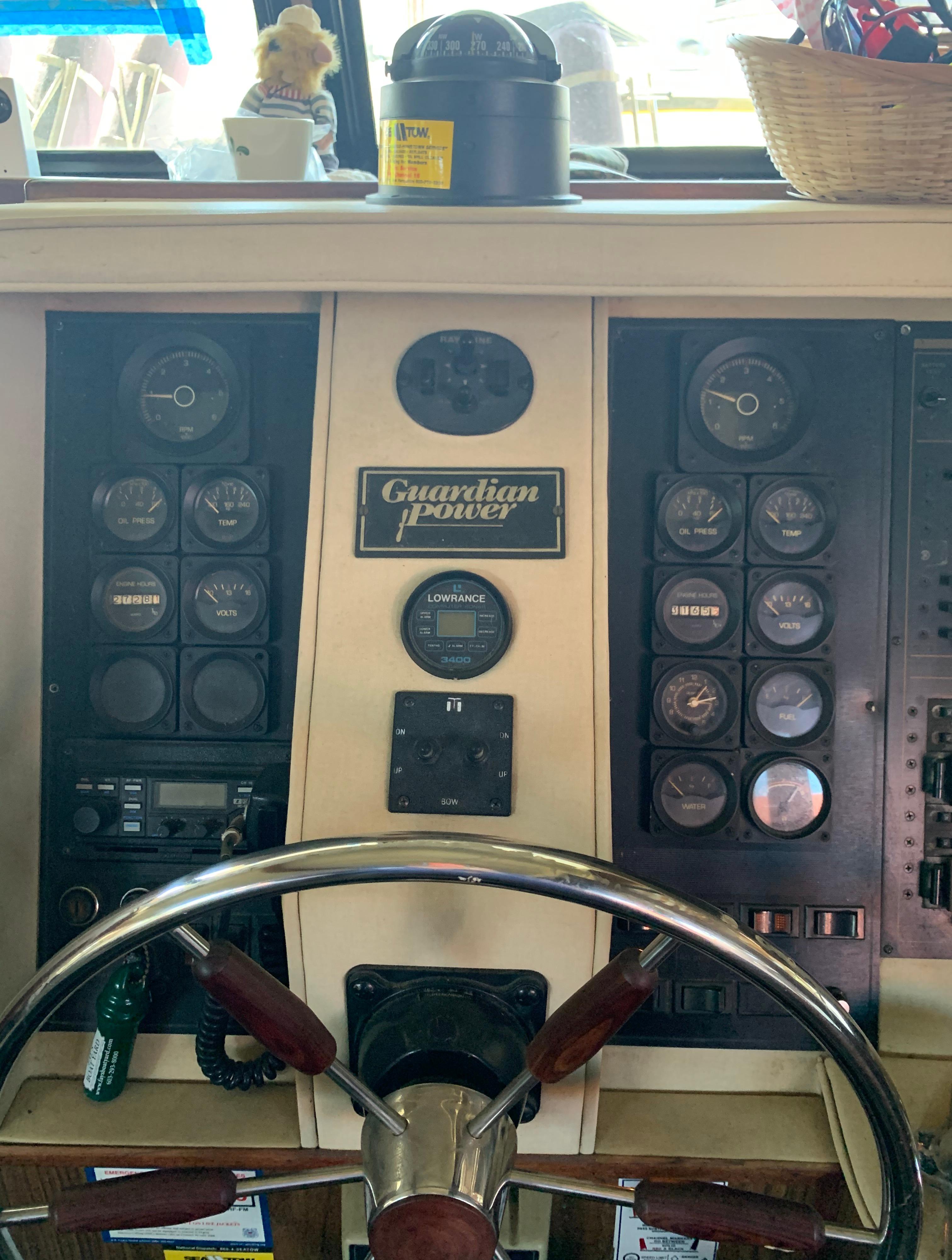 1988 Blue Water Coastal Cruiser helm with Guardian power controls and gauges.