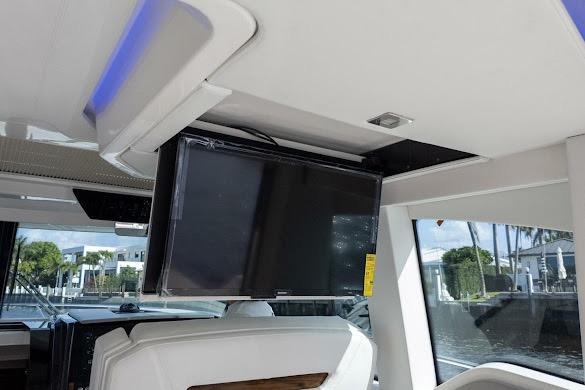 2022 Tiara Sport 43 LE interior with mounted TV and modern seating.