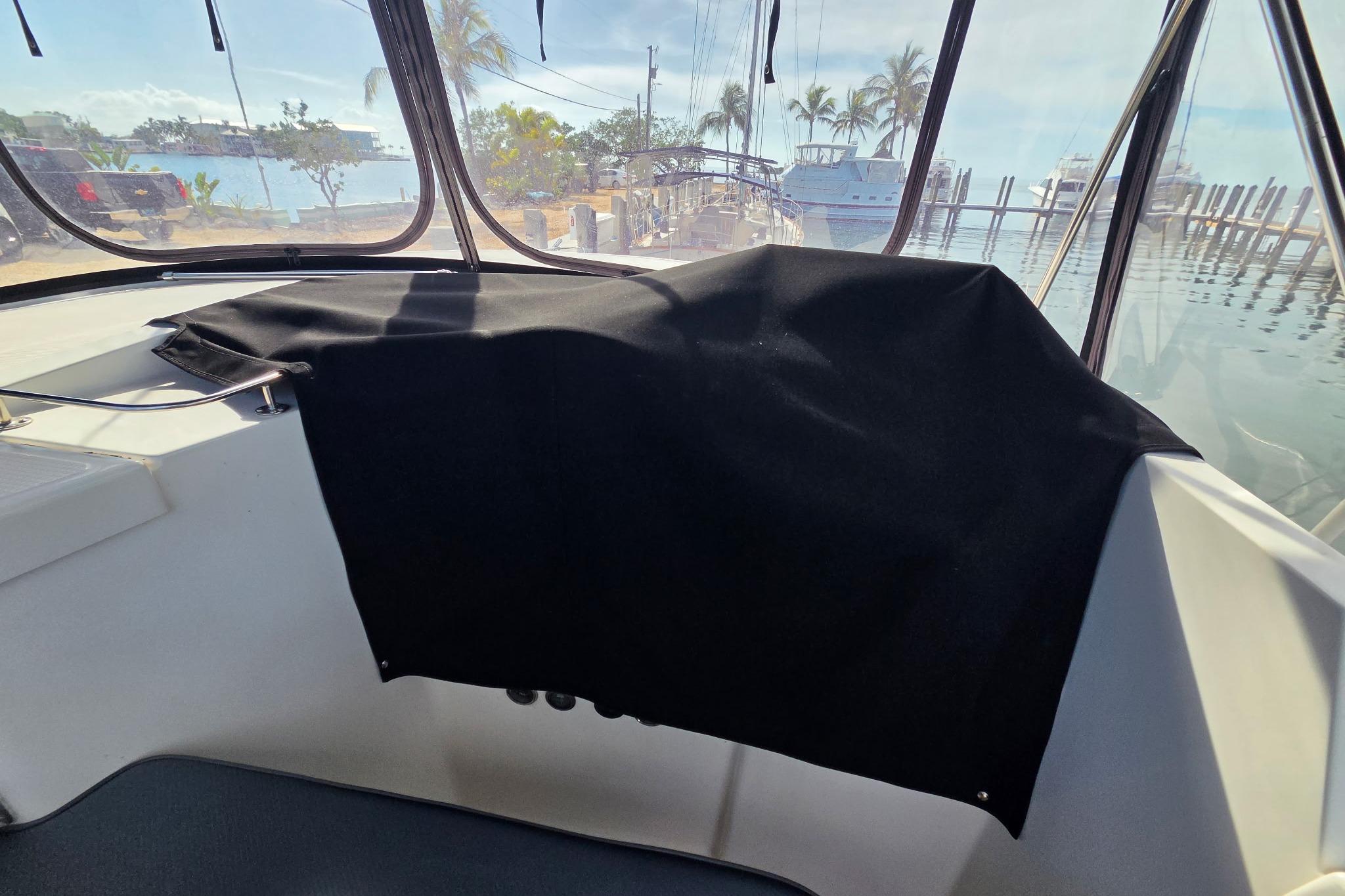 Interior view of a 2000 Fountaine Pajot Maryland 37 yacht with marina backdrop.