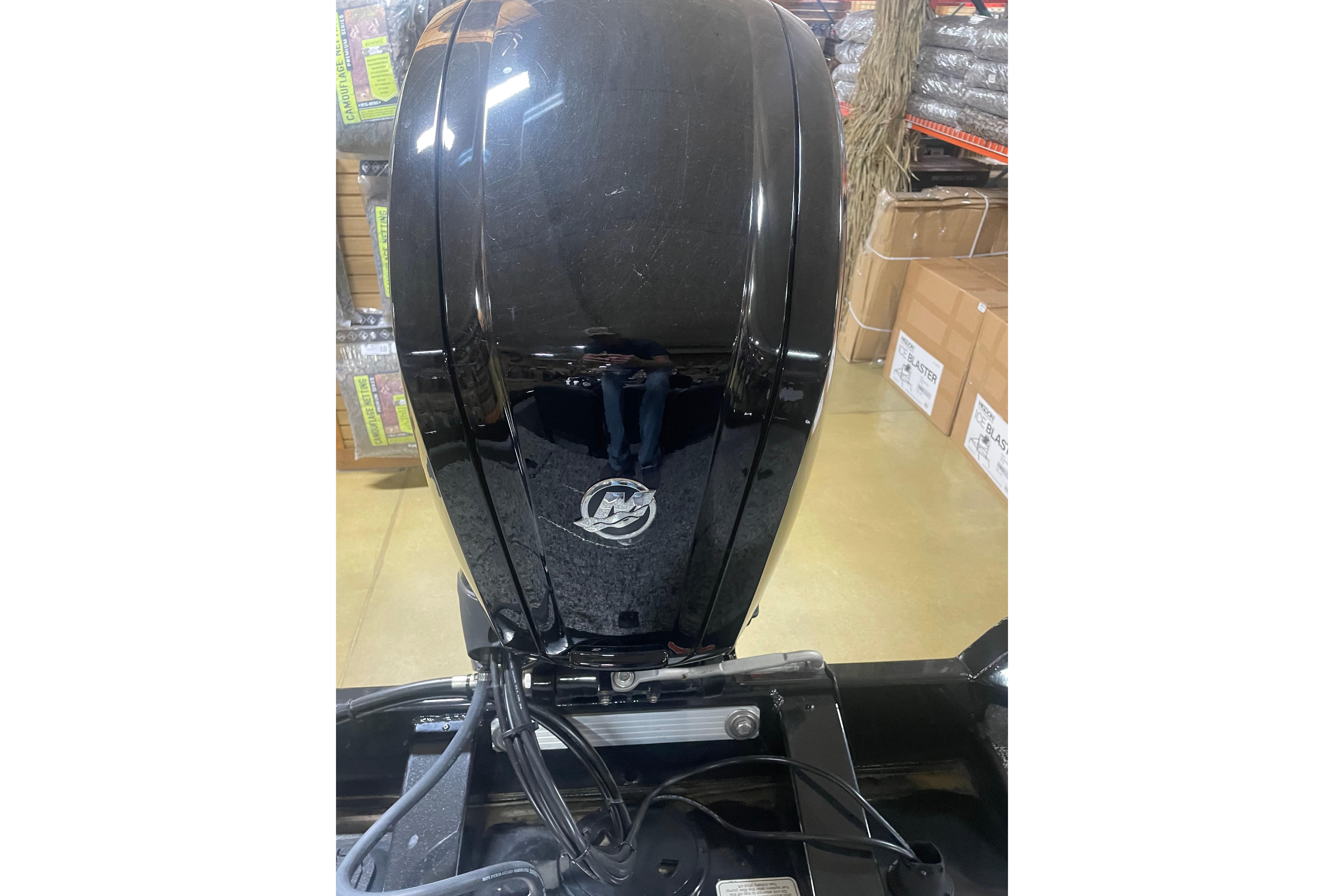 2026 Tracker Pro Team 175 Crappie Edition boat motor in showroom setting.