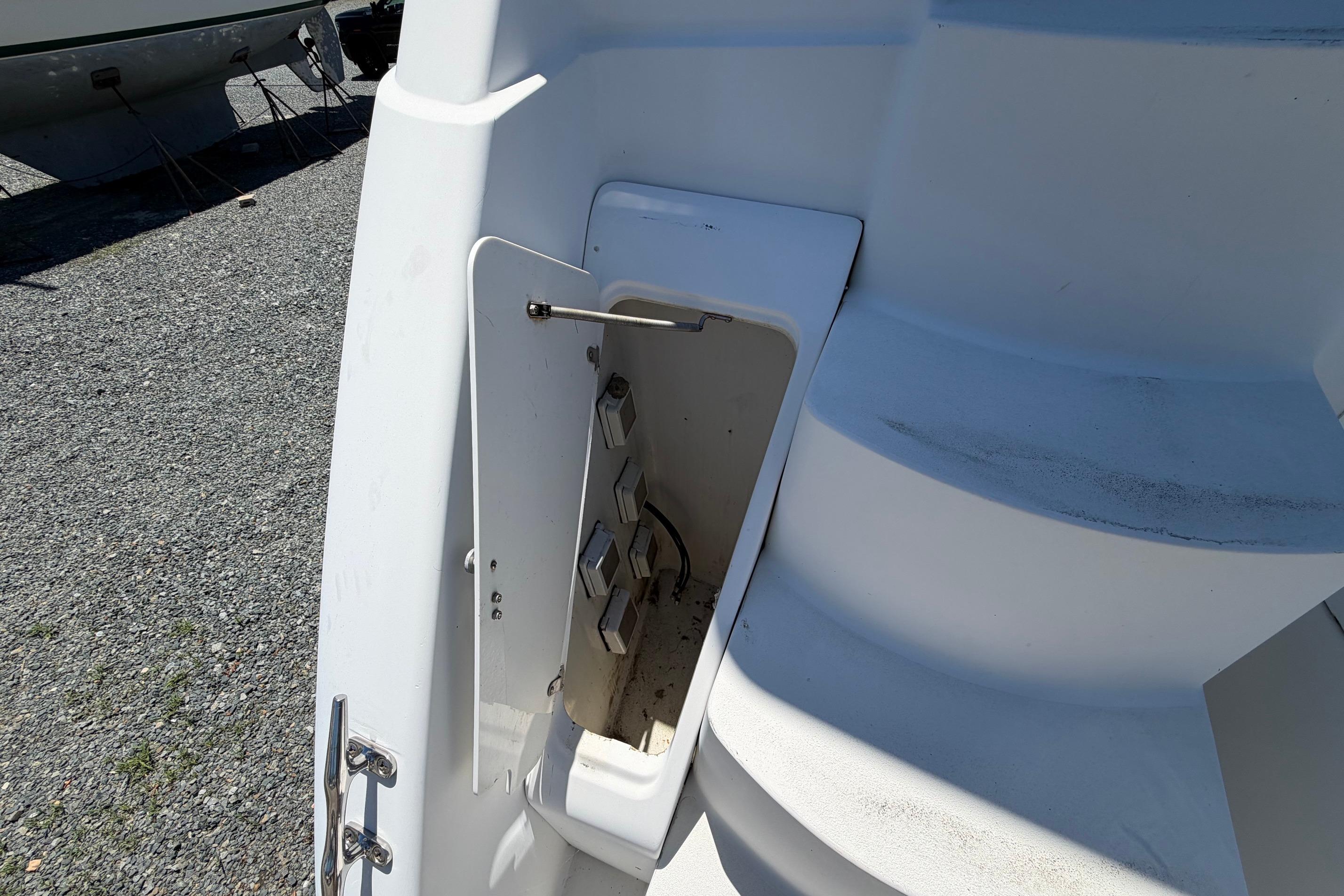 1995 Carver 356 Aft Cabin Motor Yacht showing open storage compartment near steps.