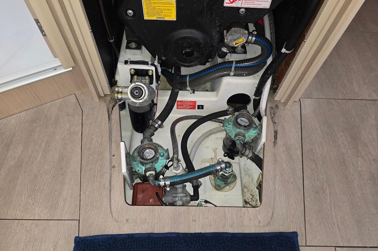 Engine compartment of 2023 Beneteau Oceanis 38.1 sailboat, showcasing mechanical components.