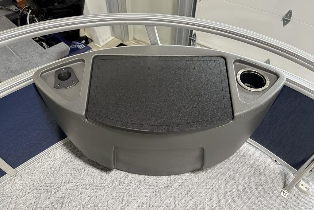 2026 Sun Tracker Bass Buggy 18 DLX boat console with cup holder and storage.