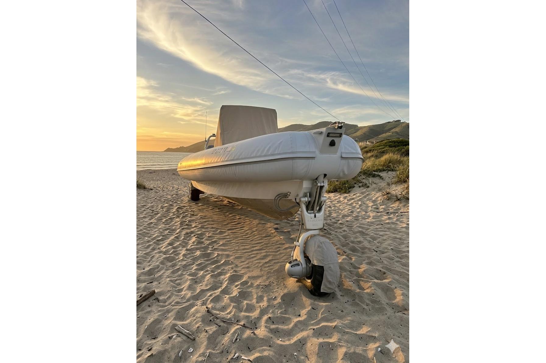 2020 Sealegs 9m Amphibious RIB on sandy beach at sunset.