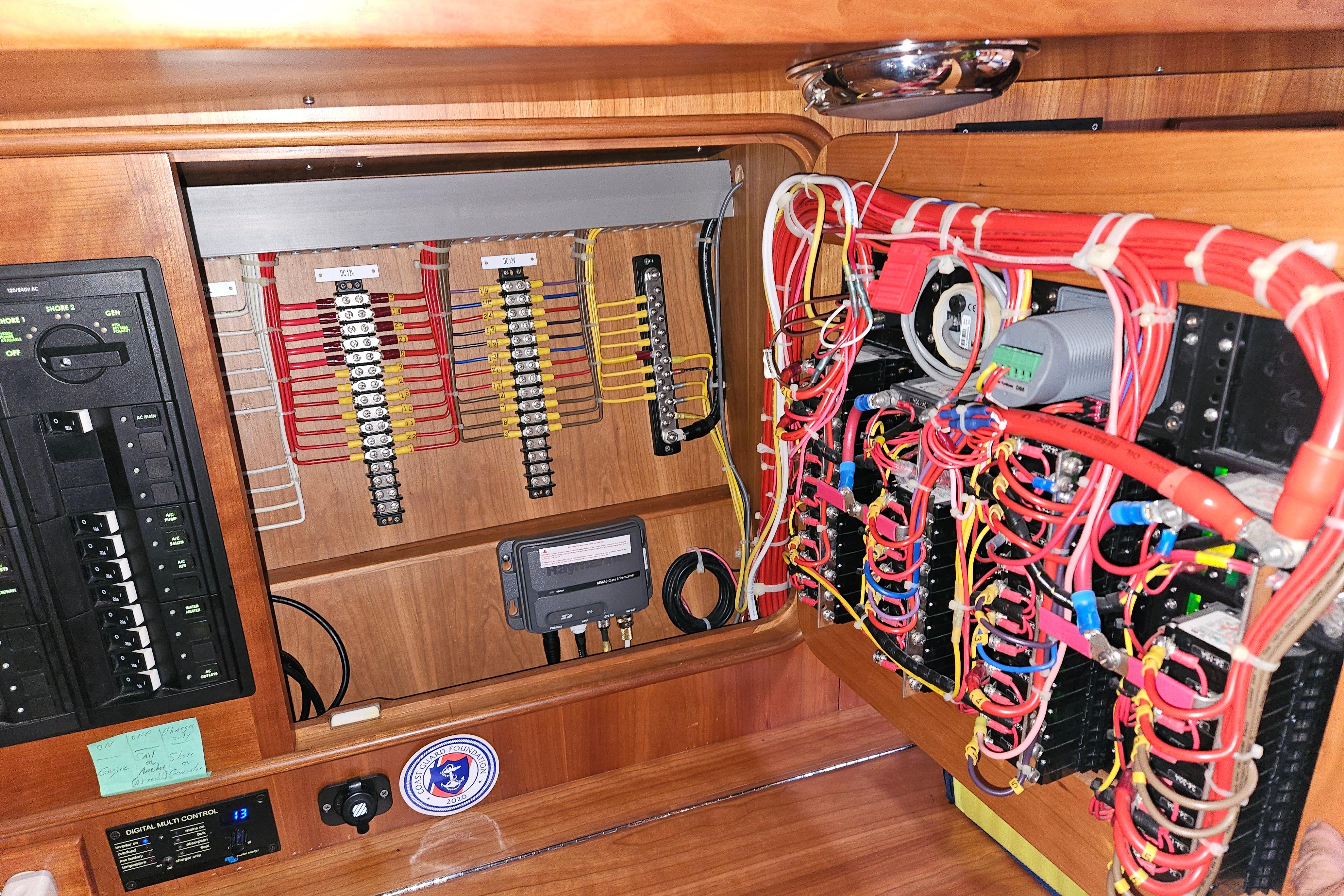 Electrical panel with organized wiring in a 2013 Passport 470 Center Cockpit yacht.