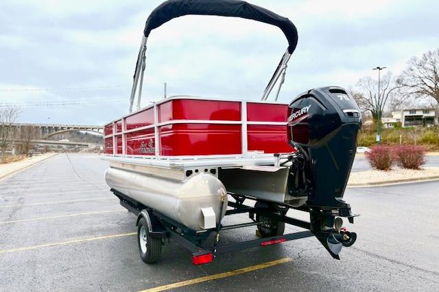 2026 Sun Tracker Party Barge 18 DLX pontoon boat with Mercury engine on trailer.