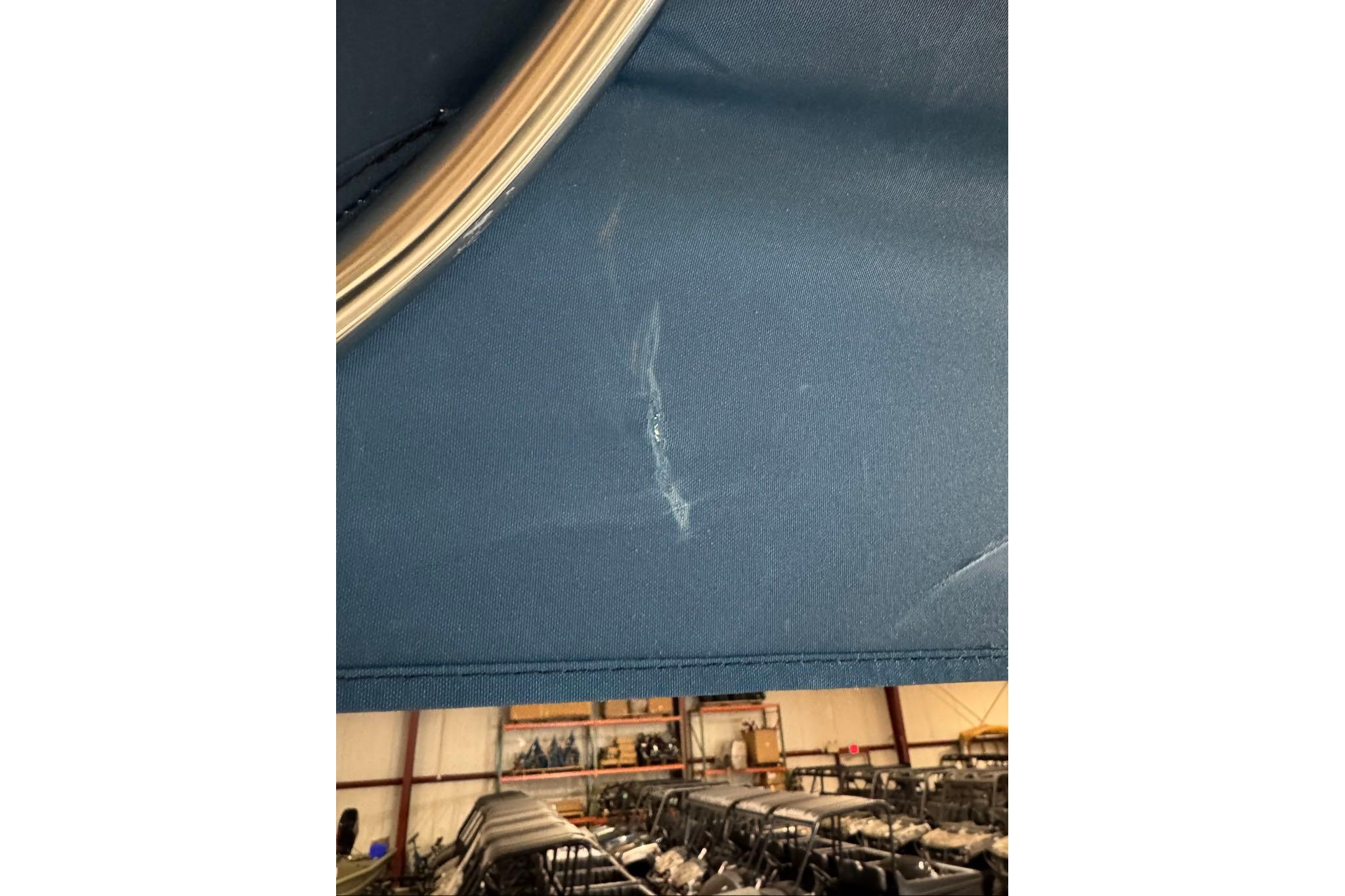 Blue fabric with a scratch, inside a warehouse, Tahoe 2150 CC, 2026 model.