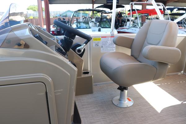 2025 Sylvan Mirage 820 CLZ DH boat interior with captain's chair and control console.