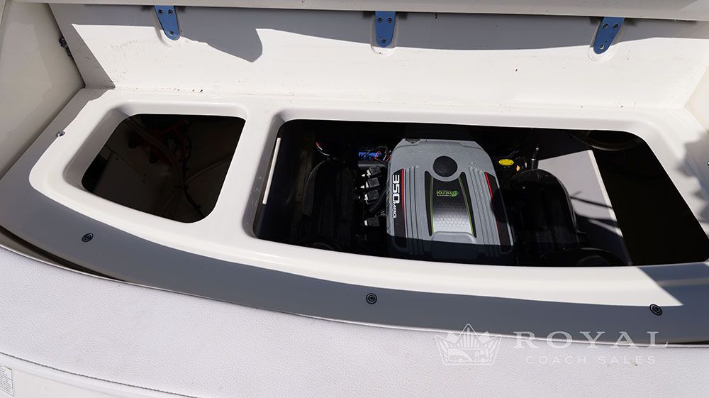 Engine compartment of a 2014 Sea Ray SLX 230 with open hatch.
