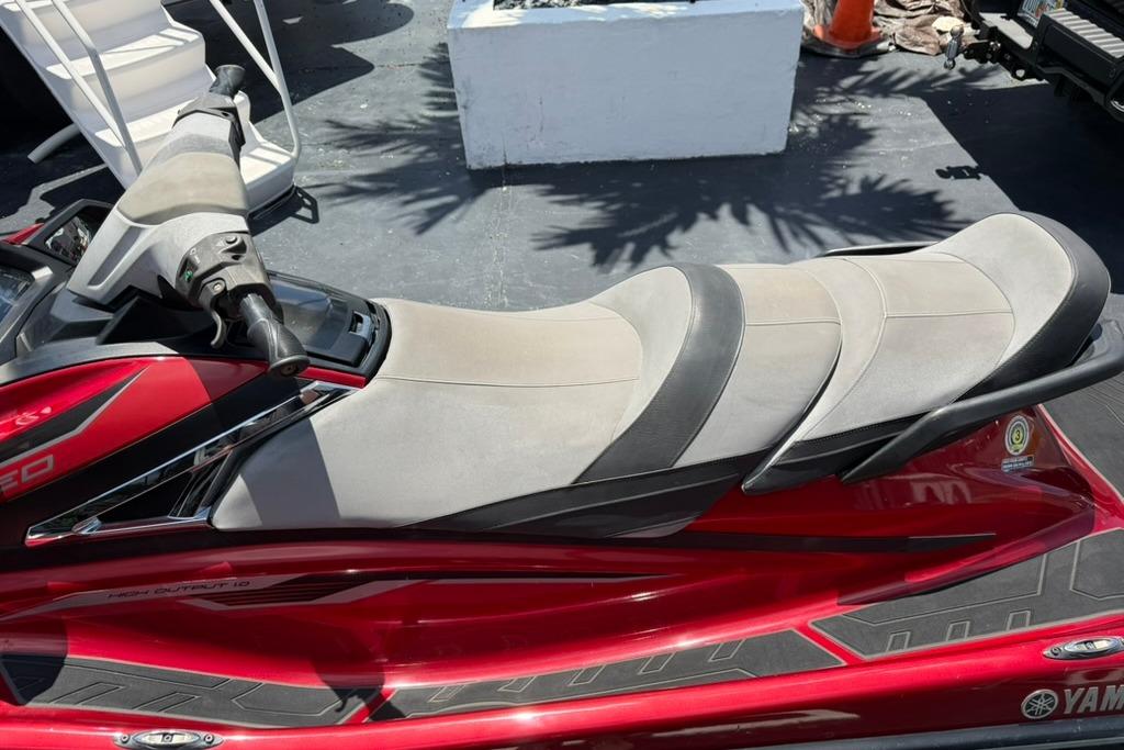 2019 Yamaha VX Limited jet ski with red and gray seating, parked outdoors.