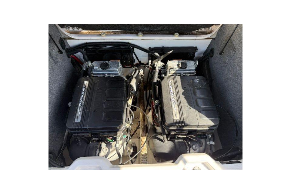 2004 Yamaha Boats SX230 engine compartment with dual engines, showcasing mechanical components.