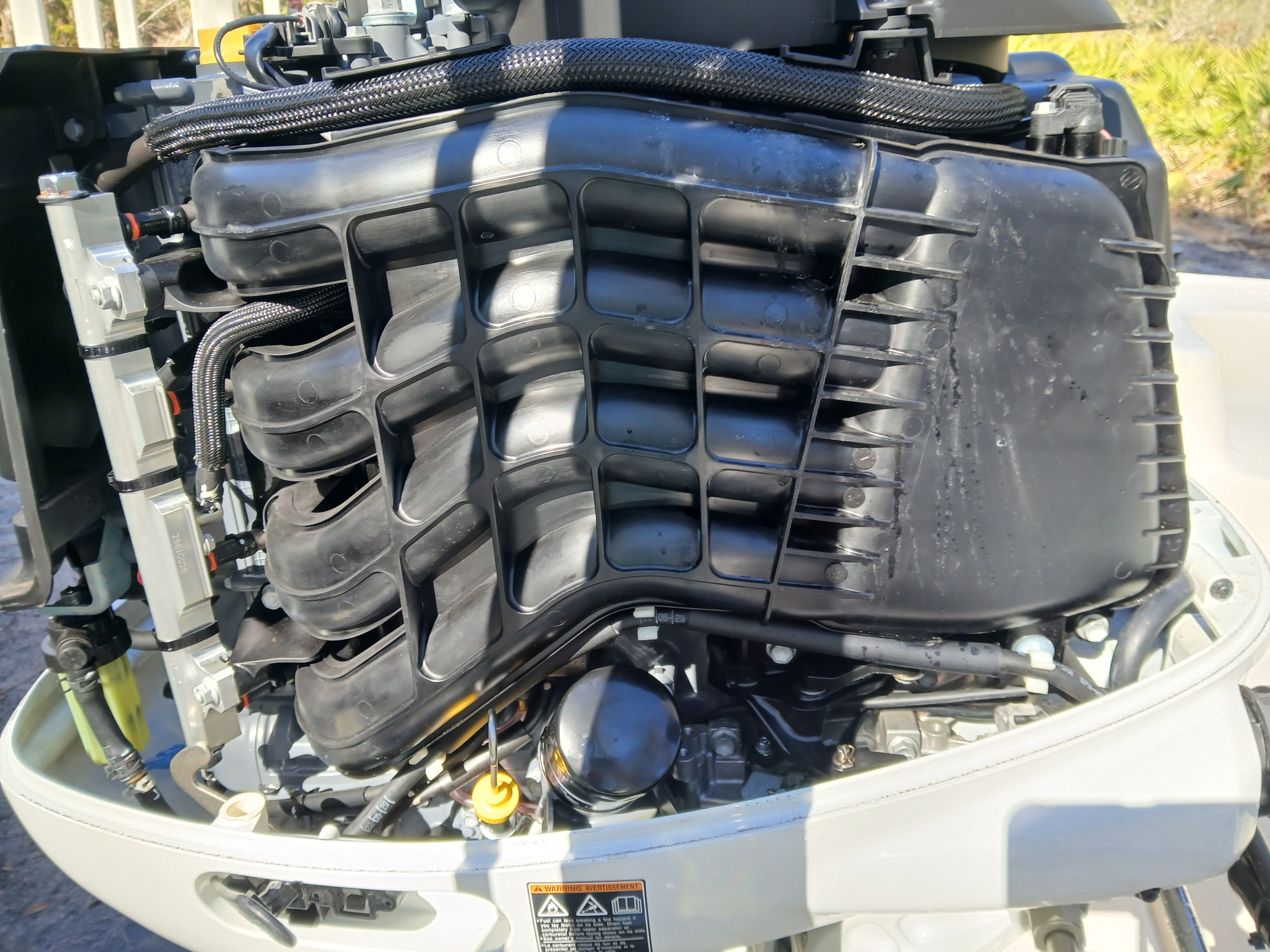 Close-up of a 2023 Carolina Skiff 192 JLS outboard motor.